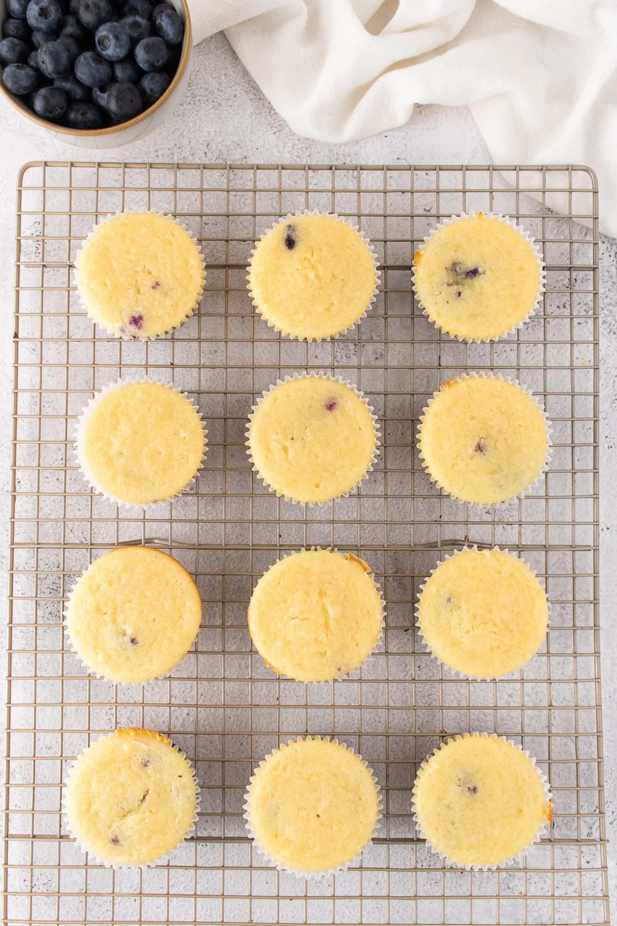 Cupcakes cooling on a rack.