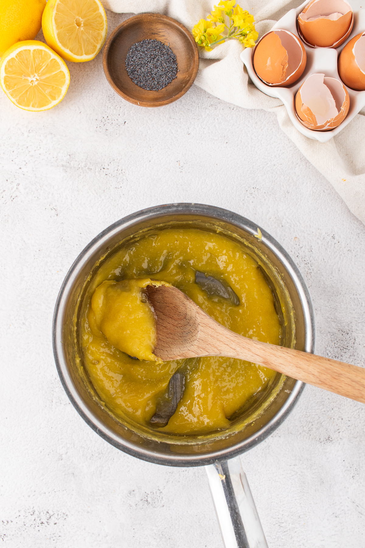 Lemon curd cooking in a pot.