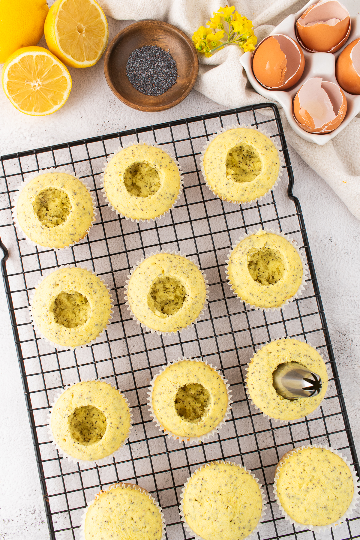 Holes cut into the center of the cupcakes.