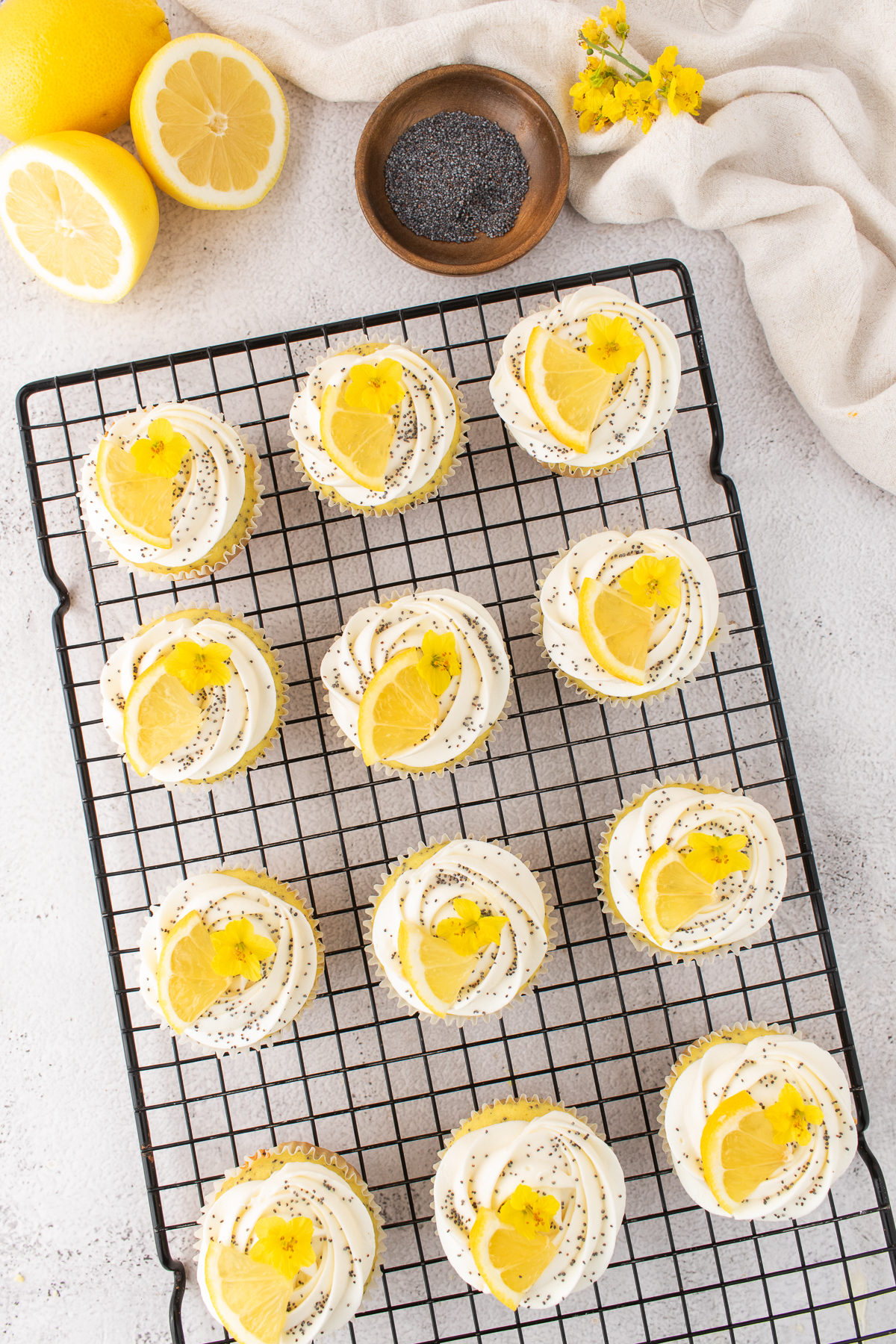 Frosting and lemon slices added to the top of the cupcake.