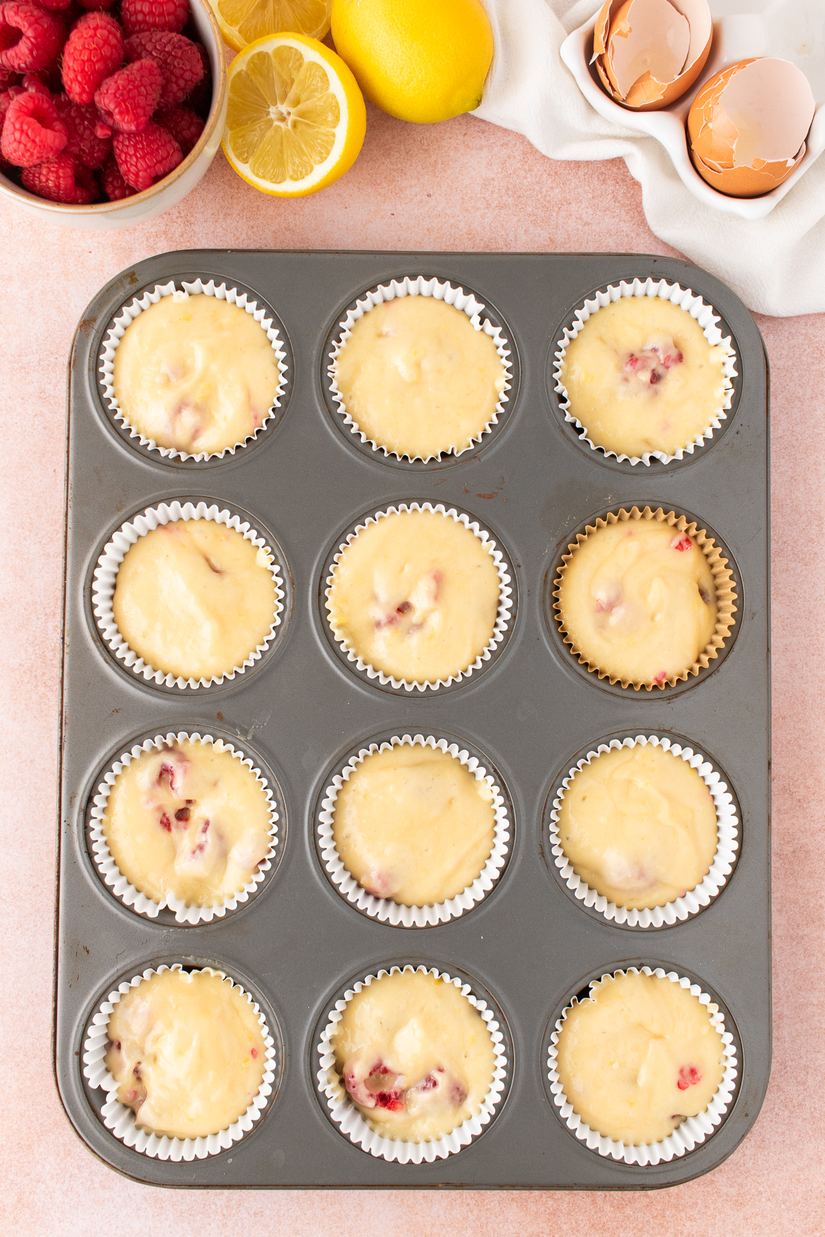 The batter scooped into the cupcake liners.