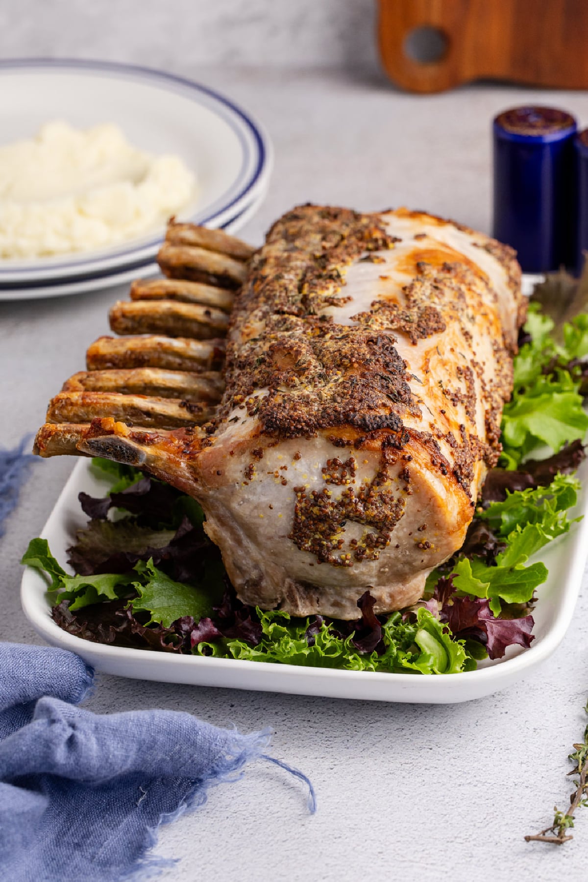 A pork rib roast on a bed of lettuce.