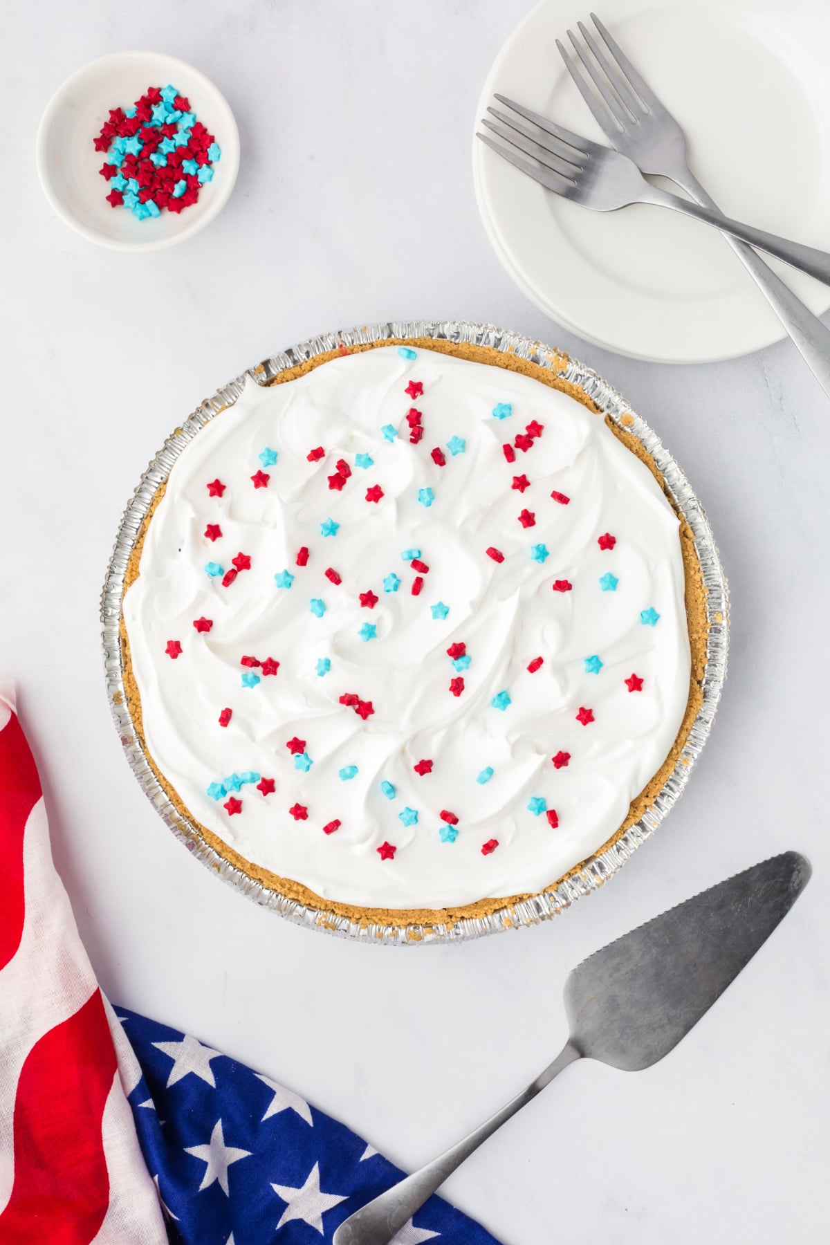 Cool whip layer over the blue layer of jello and sprinkles on top.