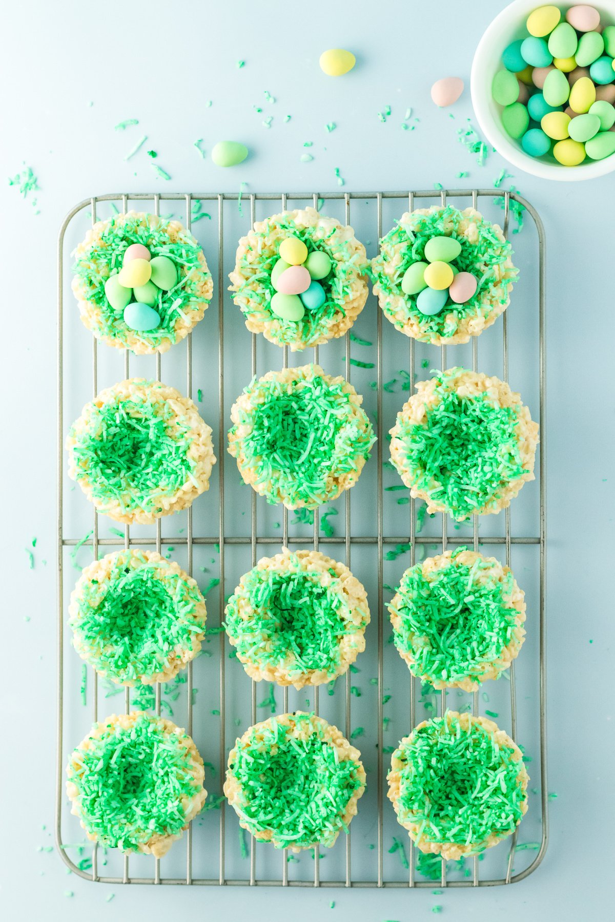 Twelve nests on a rack filled with coconut and three filled with eggs too.