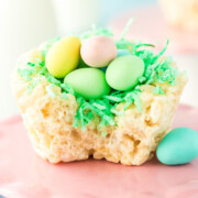 A Rice Krispie Birds Nests on a counter missing a bite.