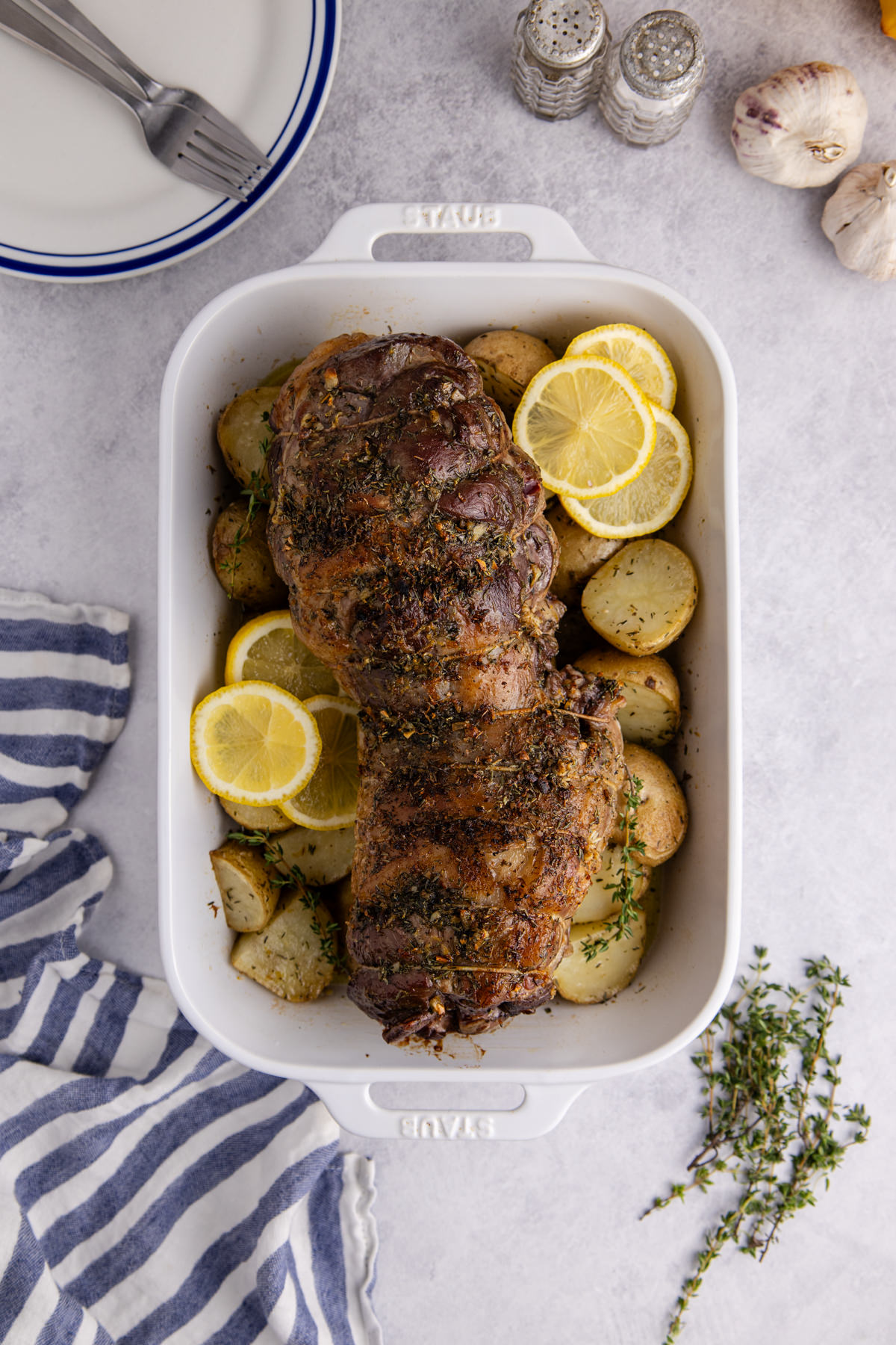 The lamb cooked and cooling on teh roasting pan.
