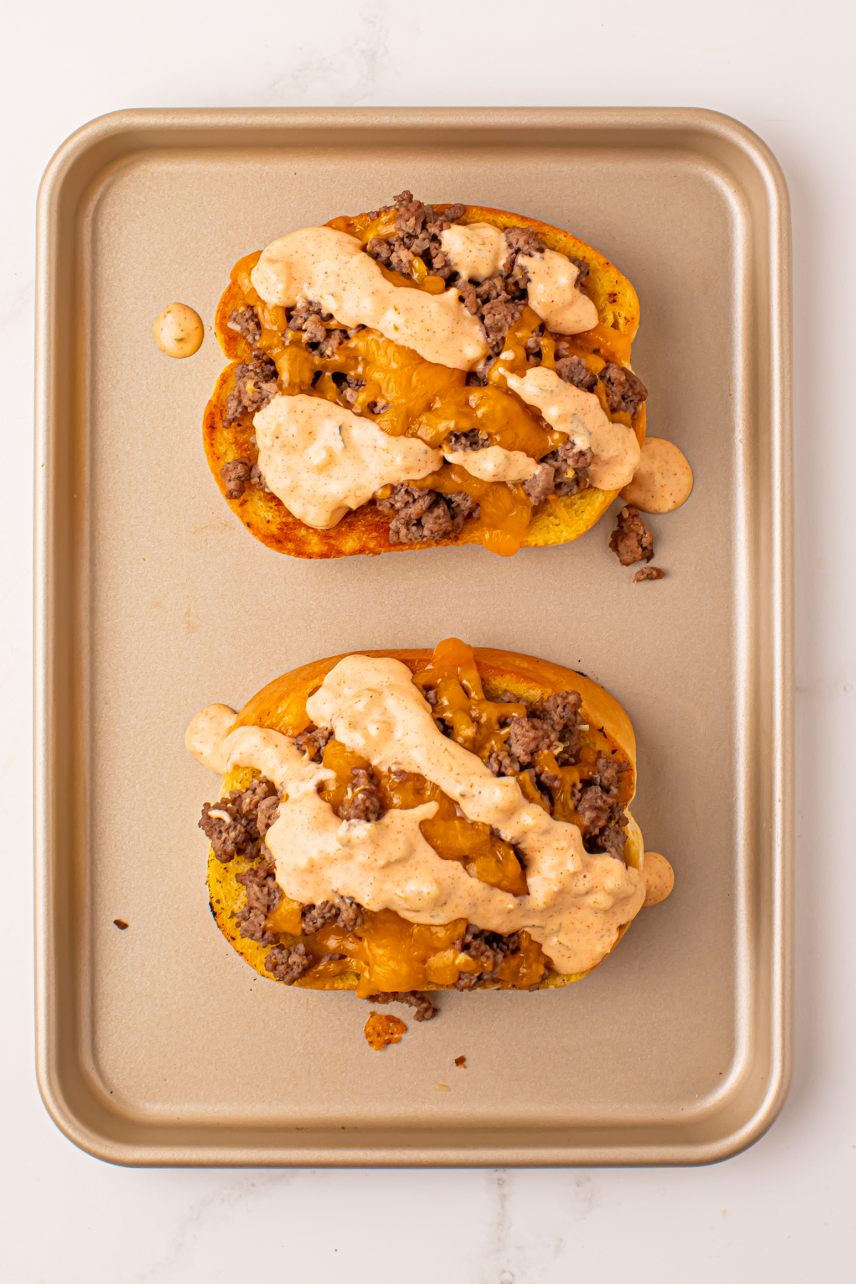 Baked Texas toast with totally melted cheese and a drizzle of Big Mac sauce.