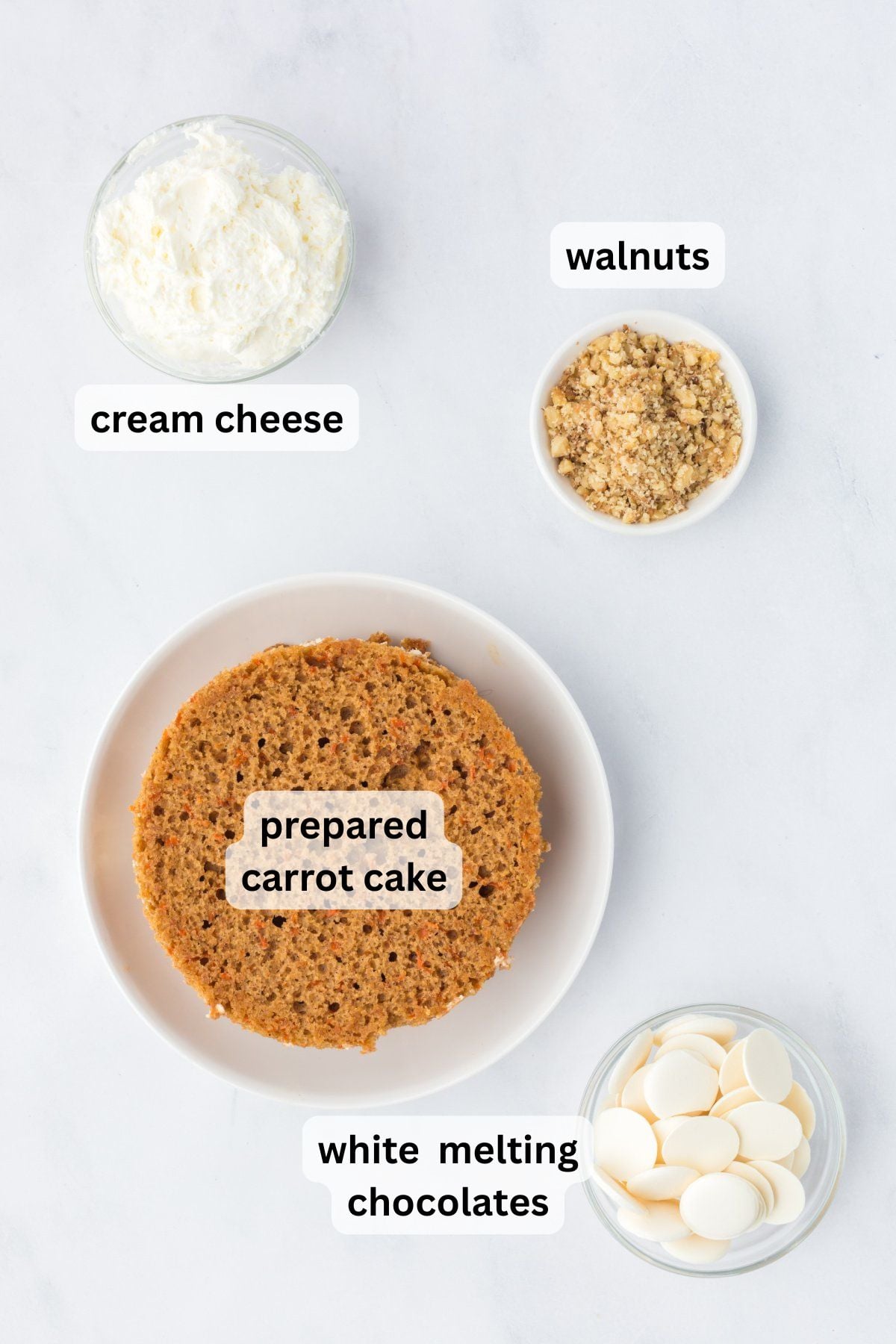 Ingredients to make these carrot cake truffles in bowls on a table.