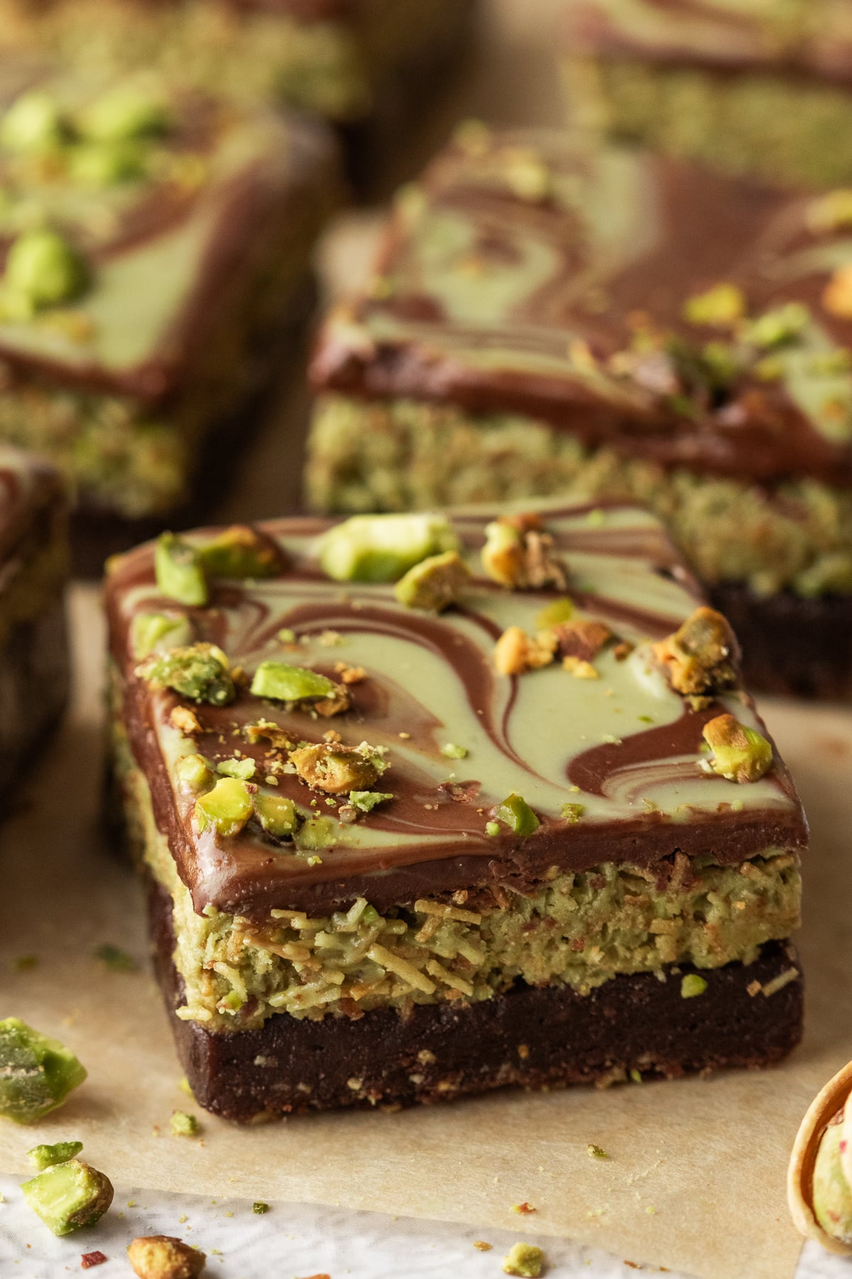 A slice of Dubai brownie on parchment paper.