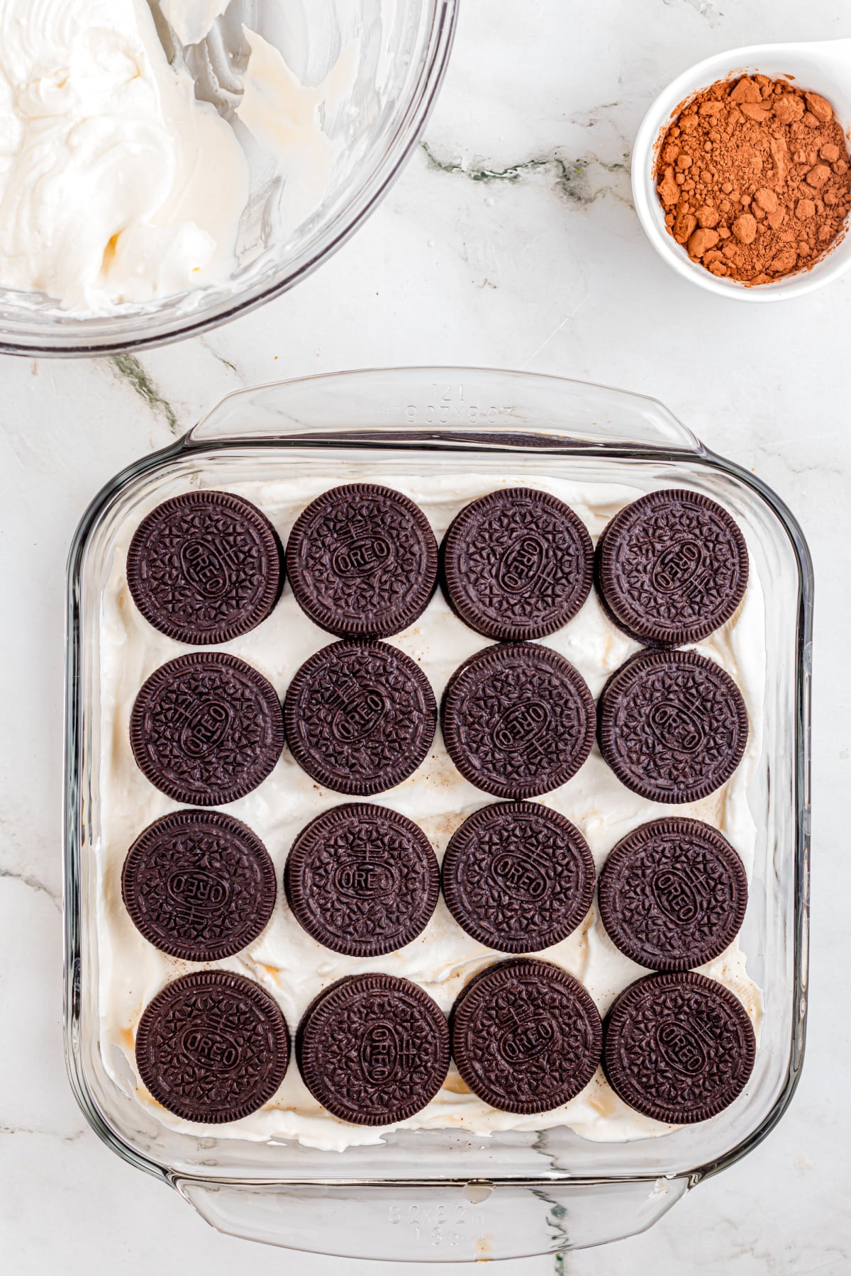 Shows the second layers of Oreos on top of filling.