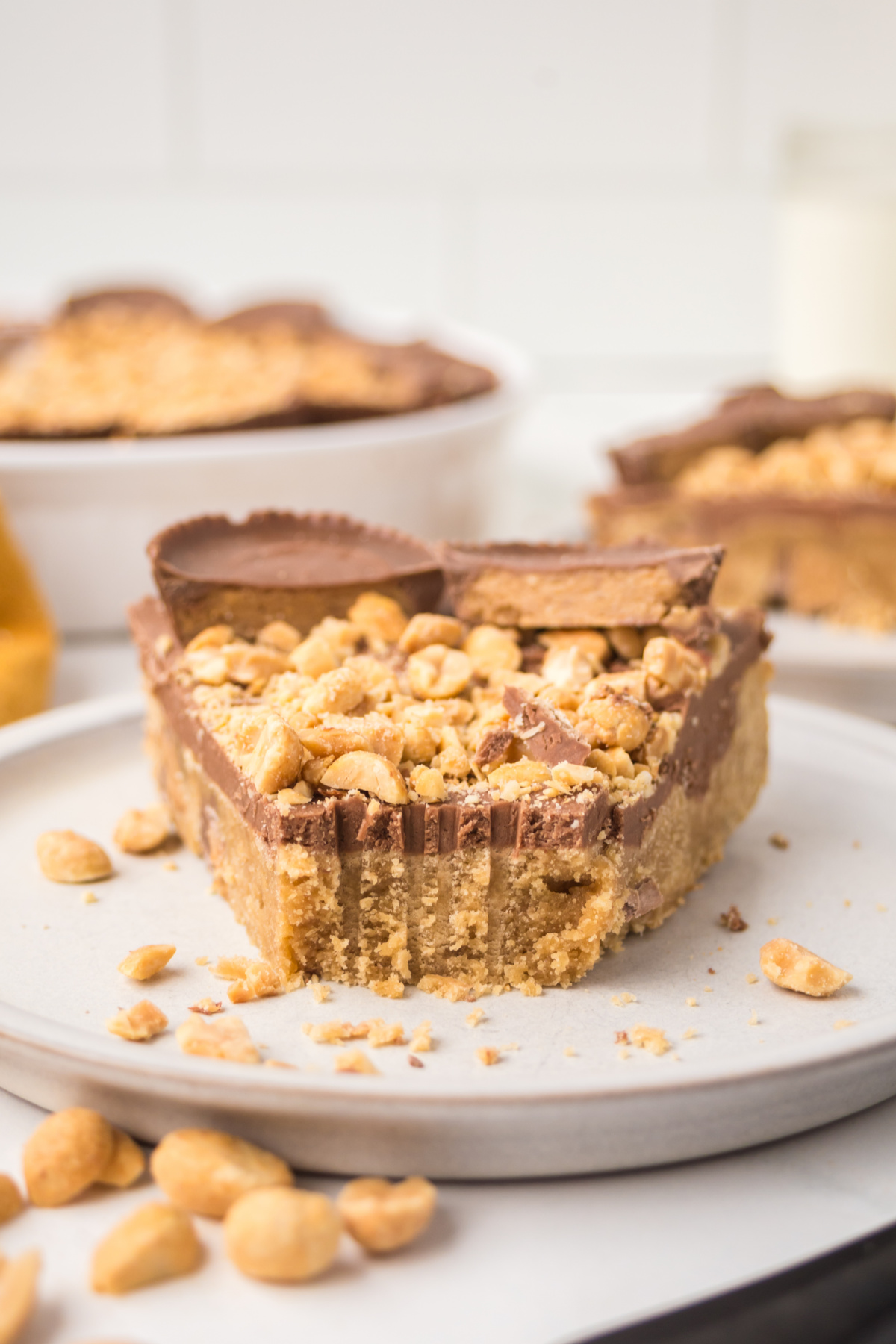 A slice of pie on a plate missing a bite.