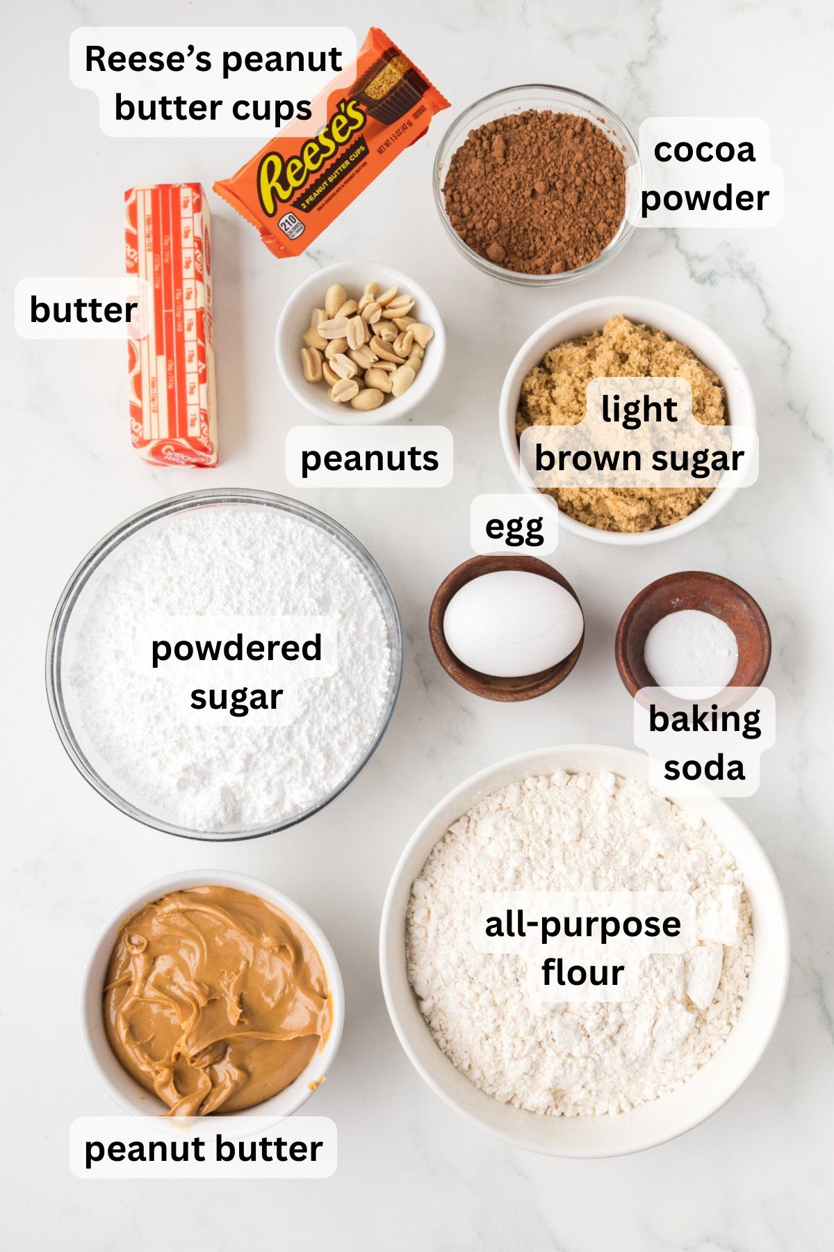 All of the ingredients needed to make Peanut Butter Cookie Pie in bowls on a table.