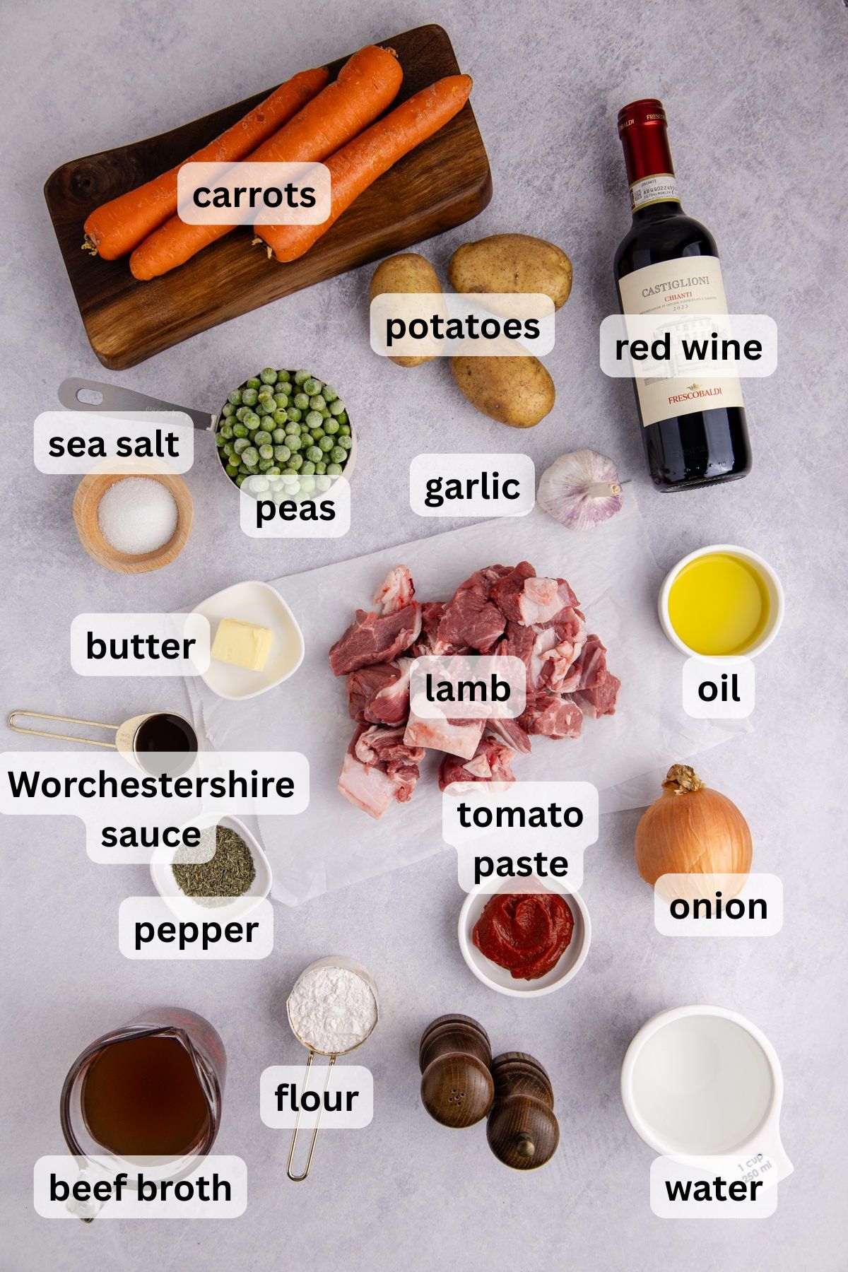 Ingredients to make this lamb stew on a table.