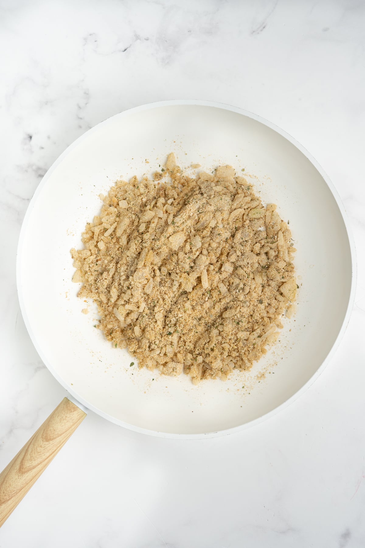 The onions and breadcrumbs in a skillet.