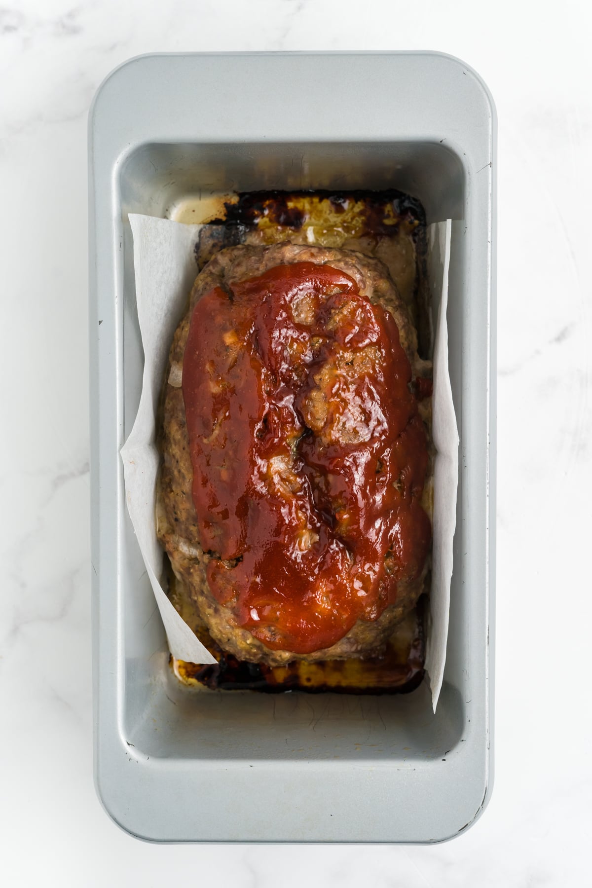 The one pound meatloaf cooked in a loaf pan.