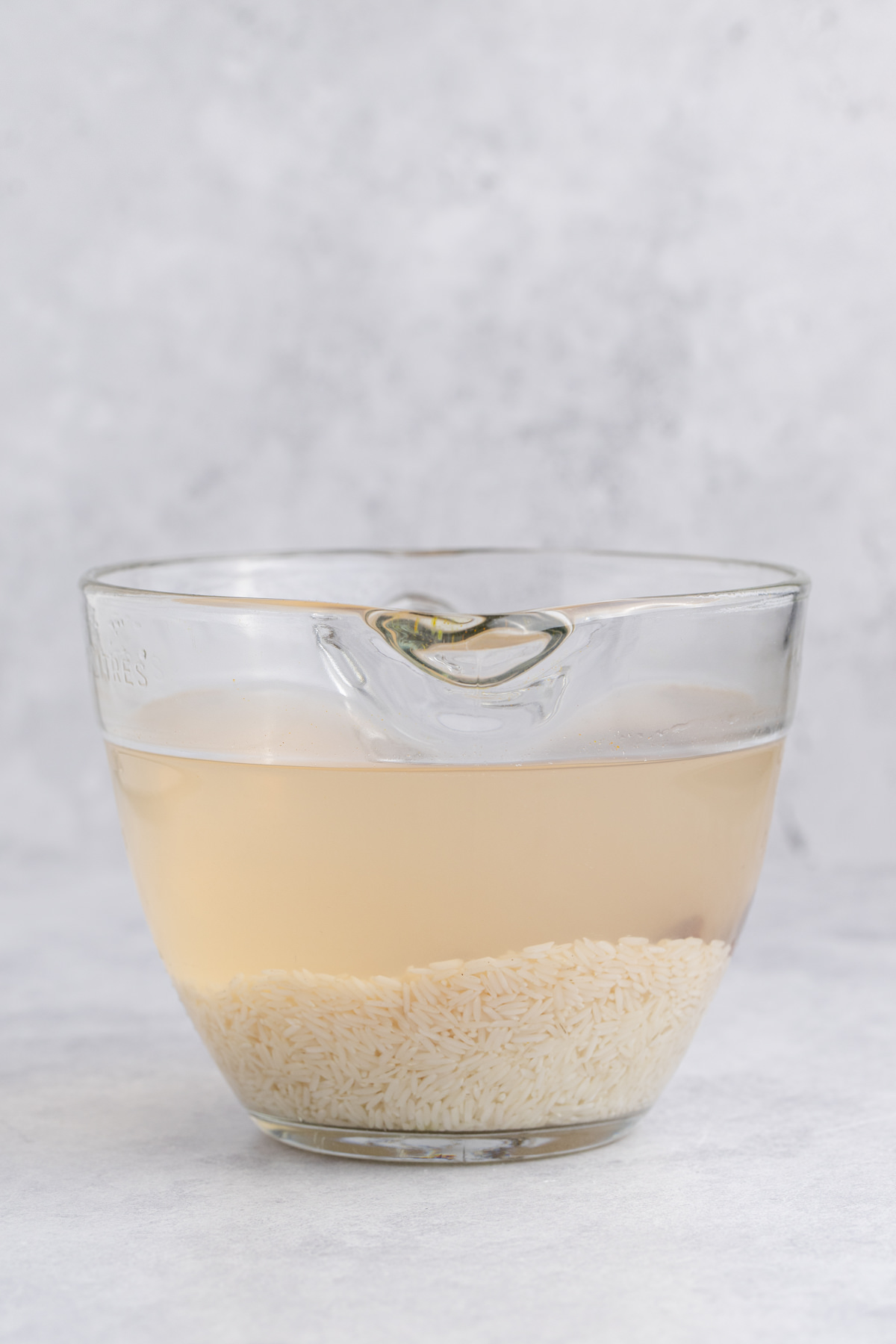 Rice and cinnamon sticks in water.