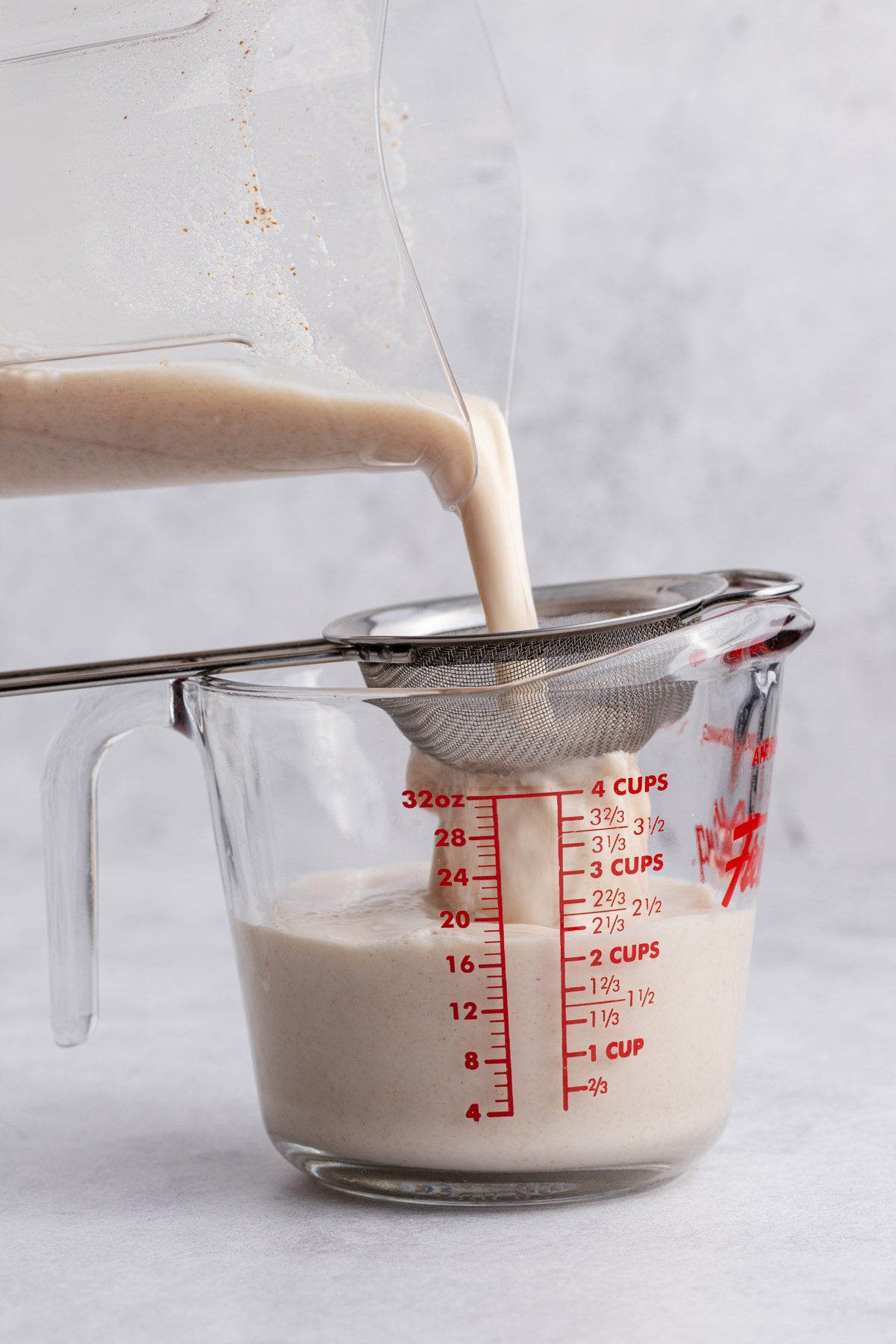 The blended rice poured through a strainer.