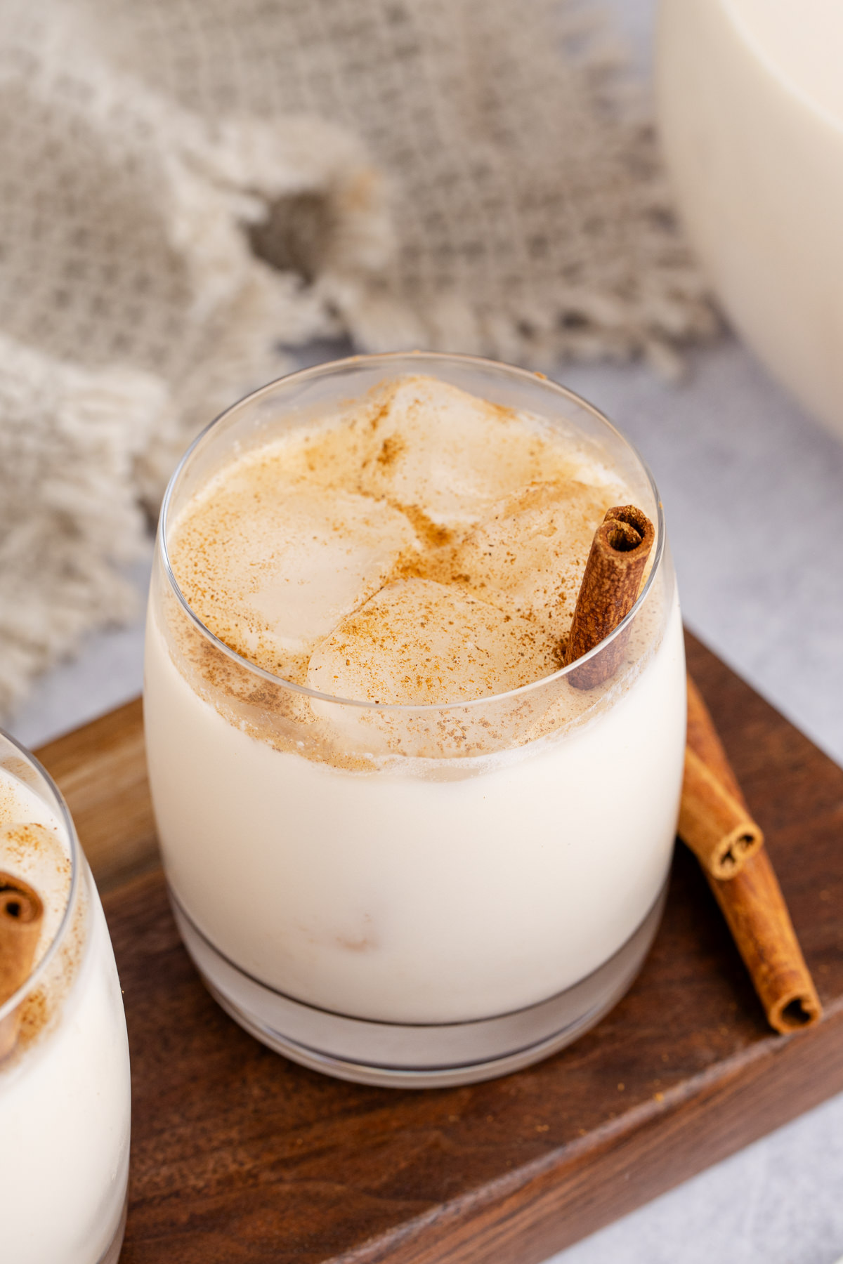 A glass of agua de horchata on a table.
