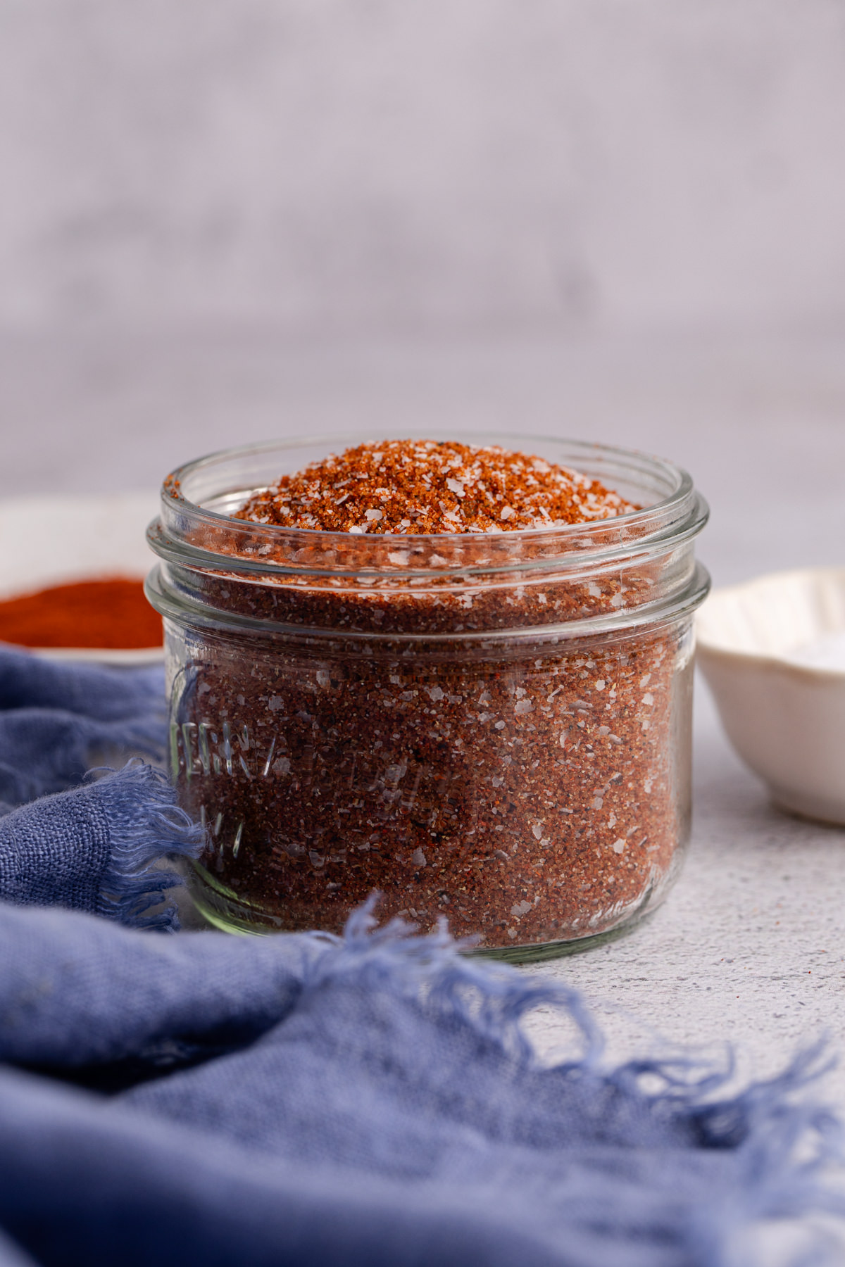 A small mason jar filled with spice rub.