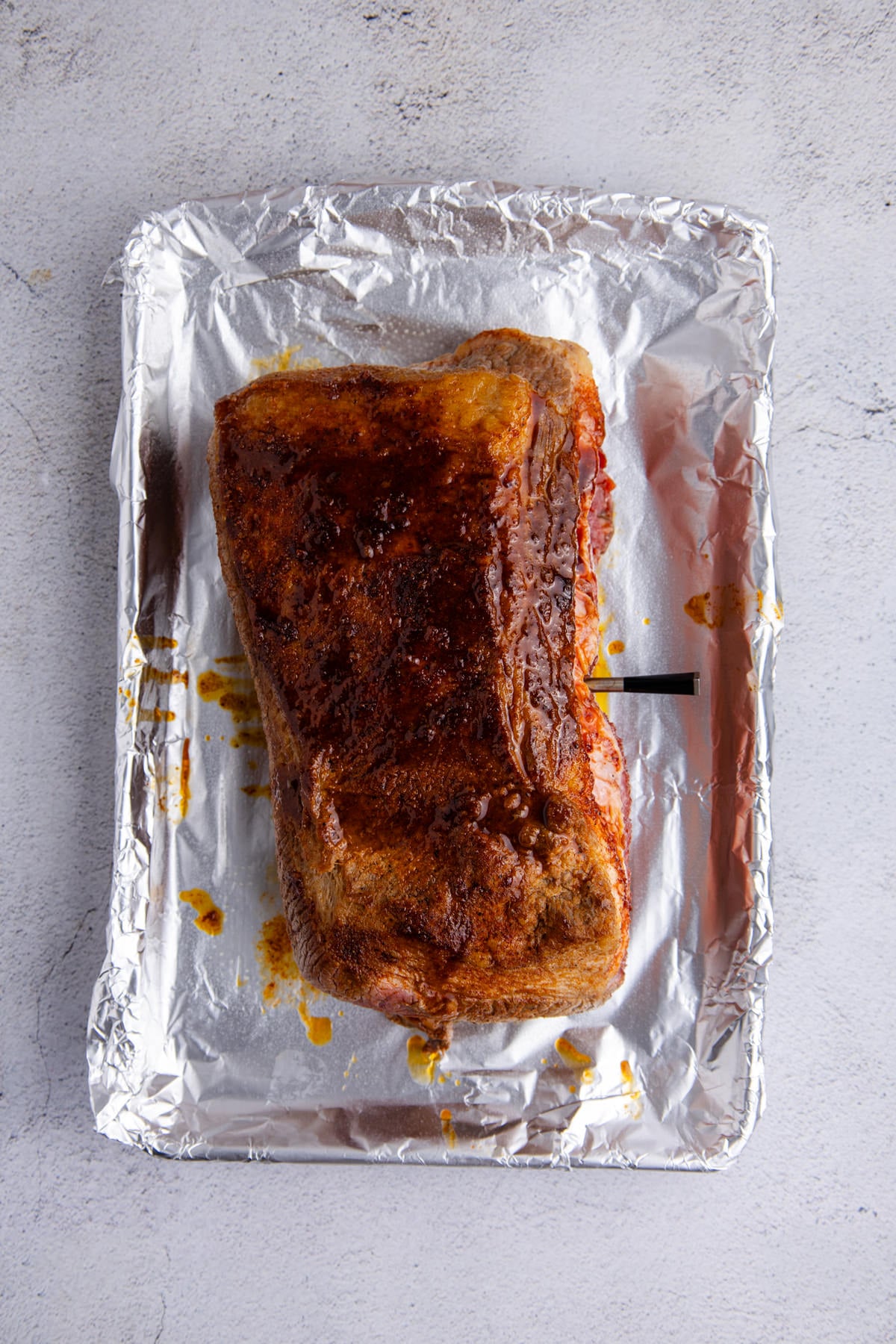 Brisket put on foil to cook.