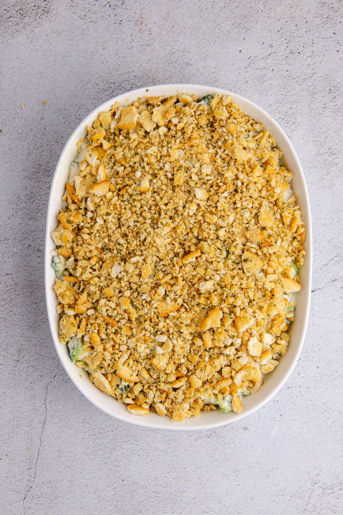 Crushed crackers with melted butter added on top of the casserole.