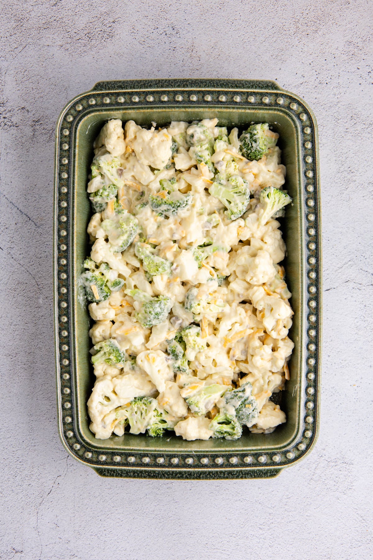 The mixture spread into the bottom of a prepared baking dish.