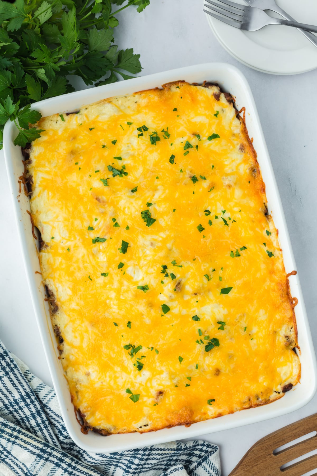 Shredded cheese on top of the casserole.
