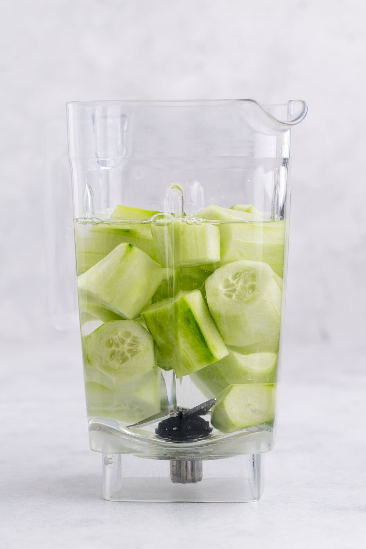 Cucumber and water in a blender.