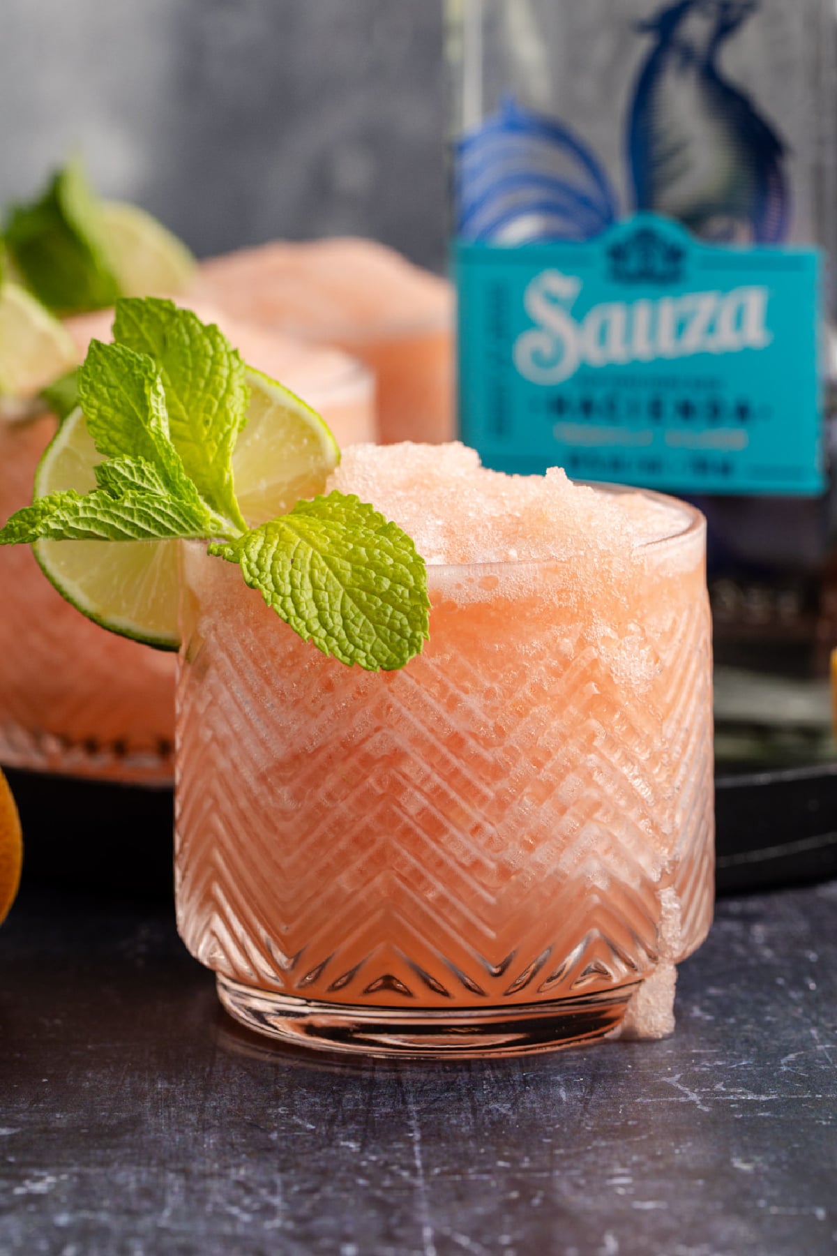 A frozen grapefruit drink in a glass.