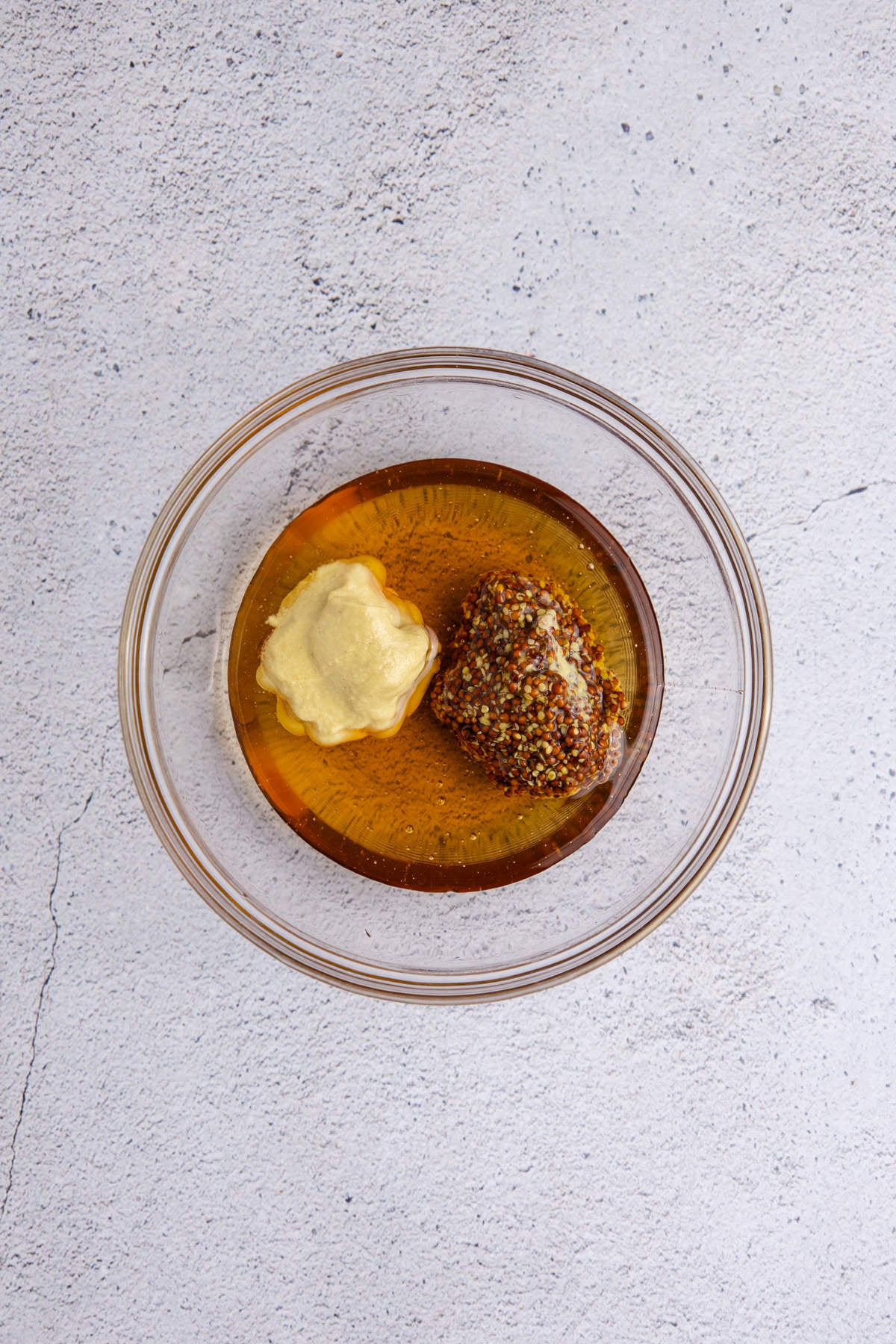 Honey dijon glaze ingredients in a bowl.