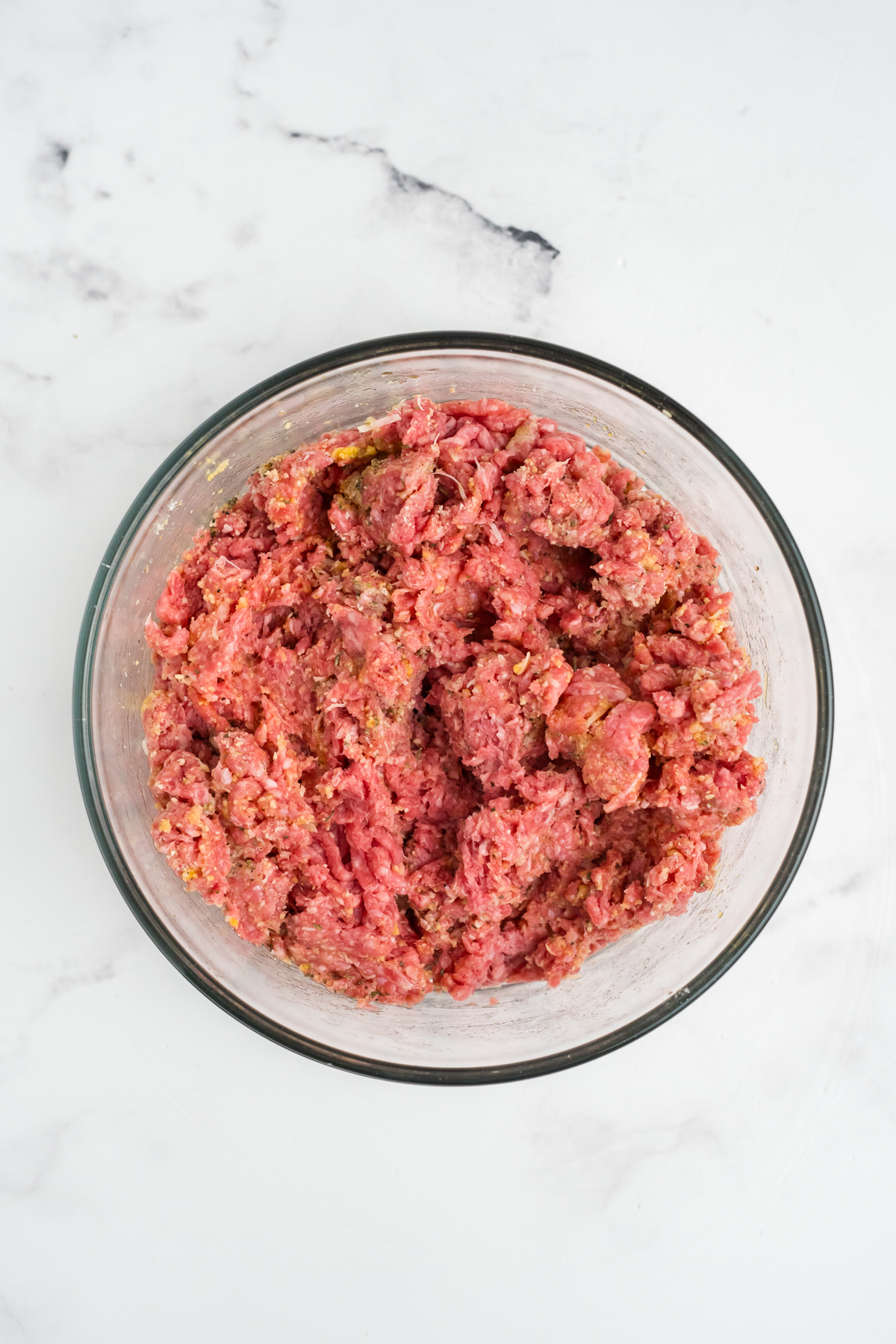 The meatball ingredients in a bowl.