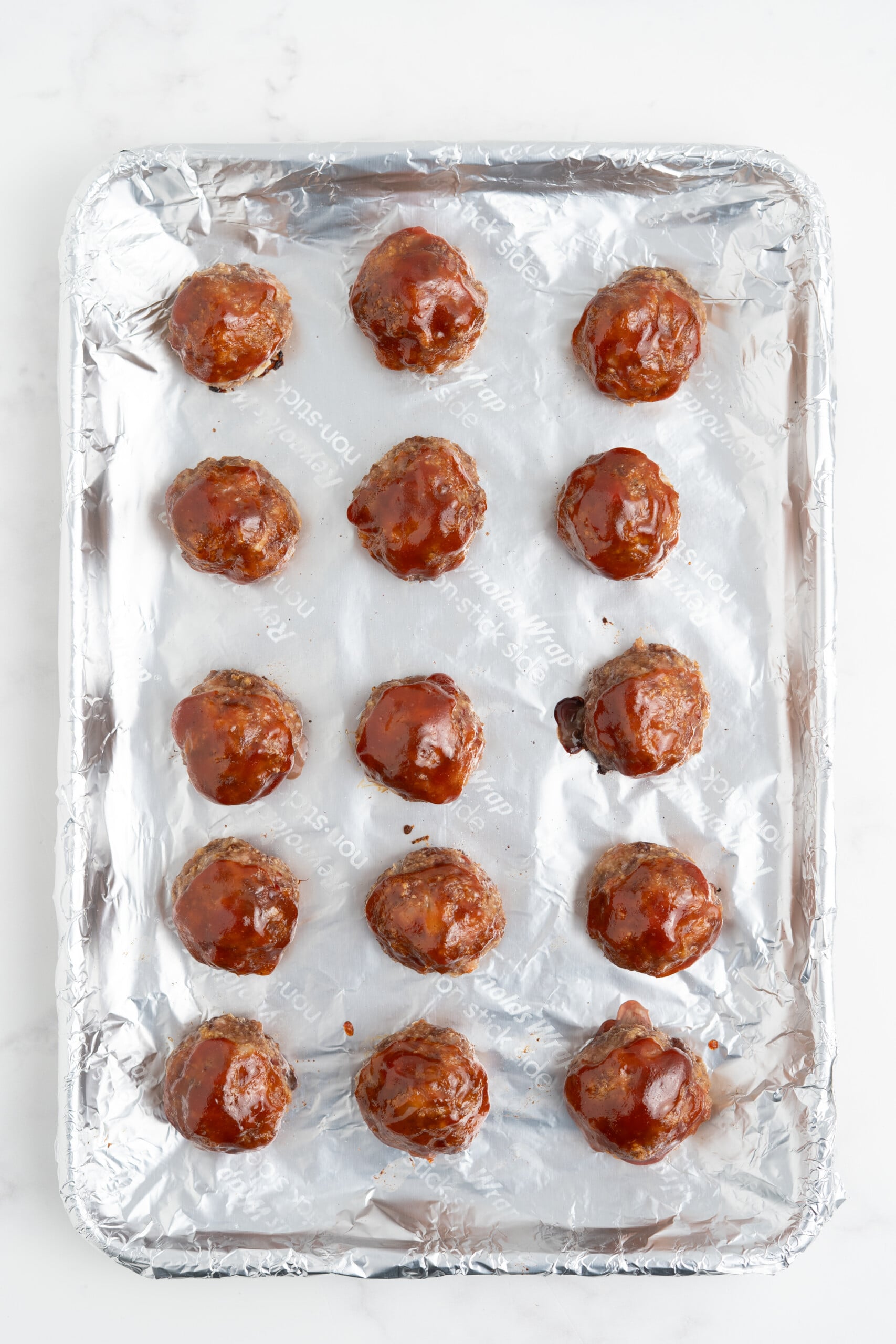 Meatloaf meatballs on a sheet pan.