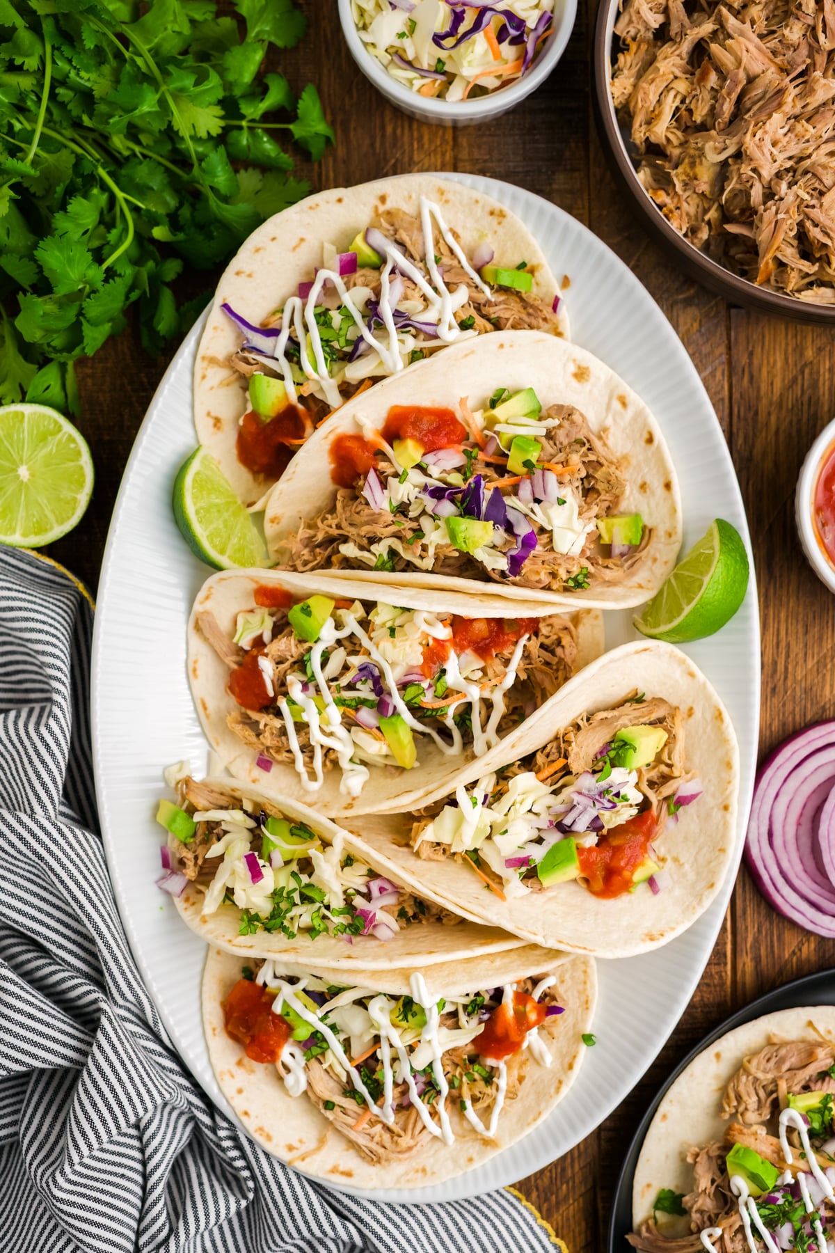 Six Made Mexican Pulled Pork Tacos on a platter.