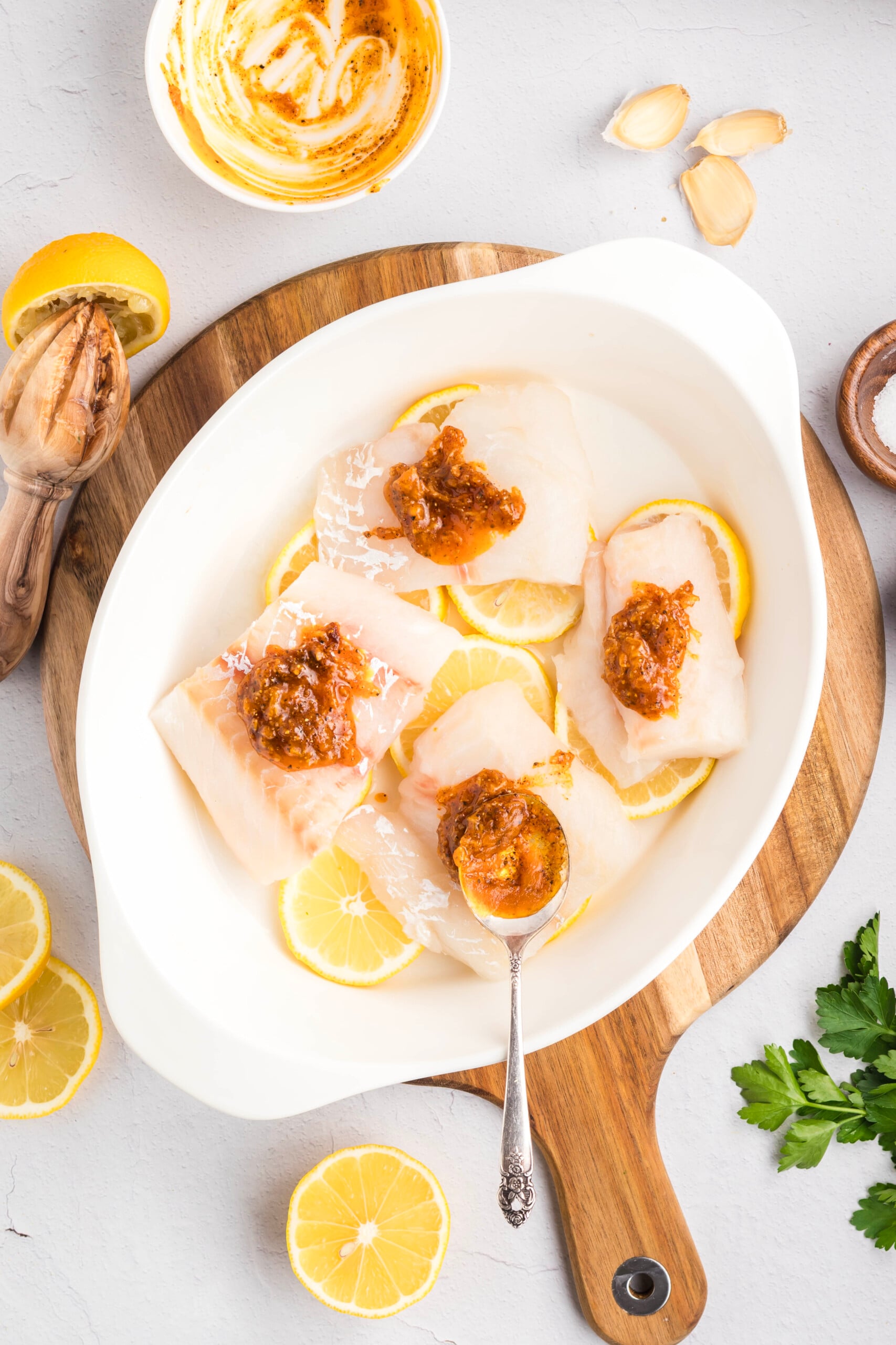 Garlic butter to the top of the haddock.