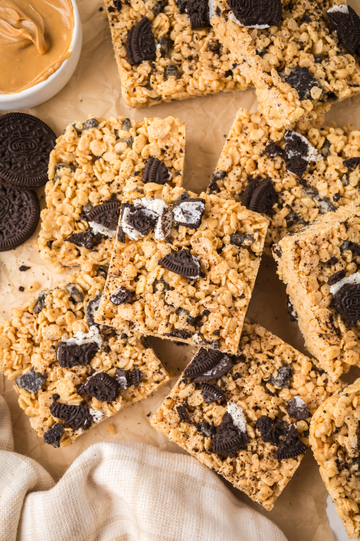 Rice Krispie treats scattered on a cutting board.