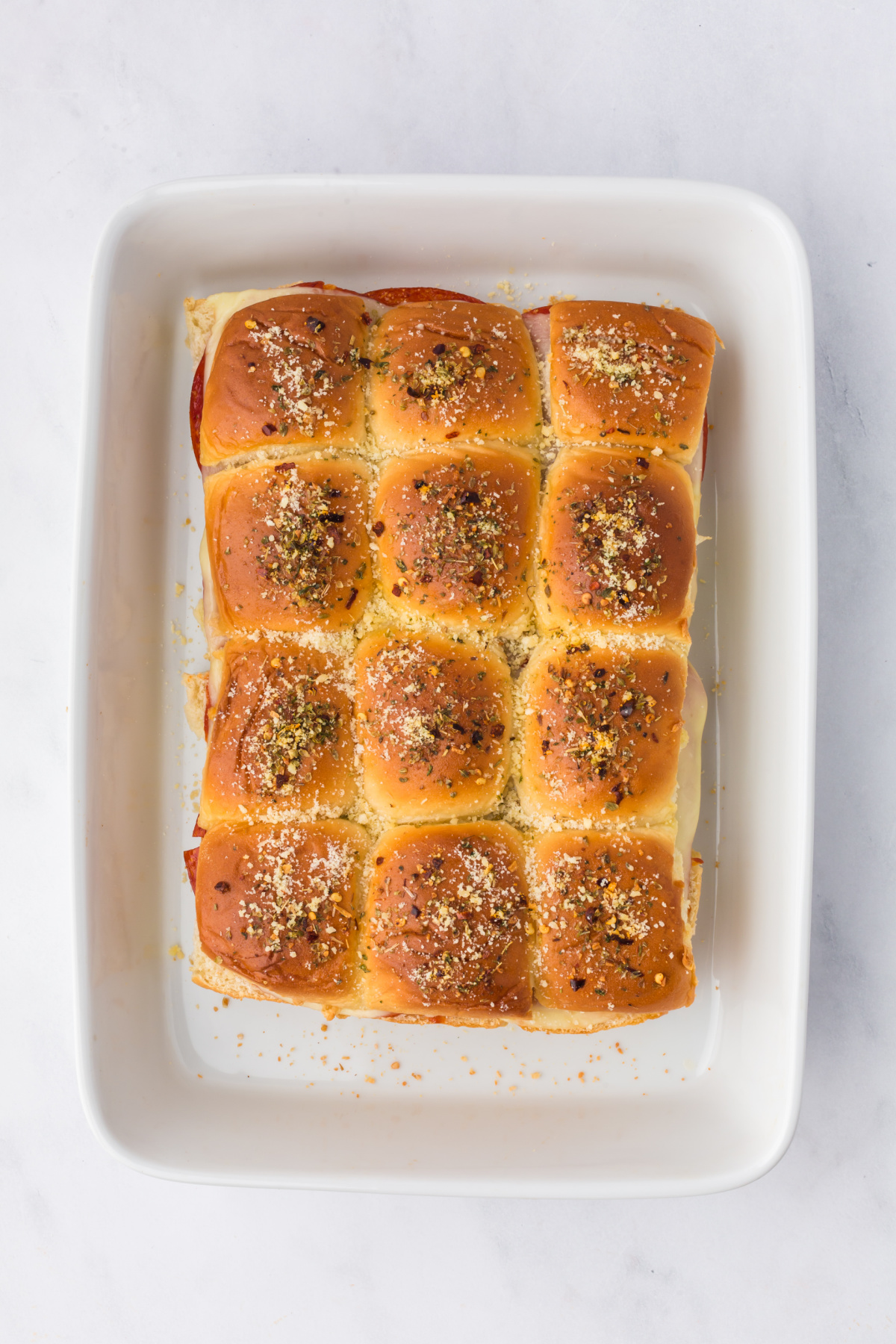 Baked sliders in a dish.