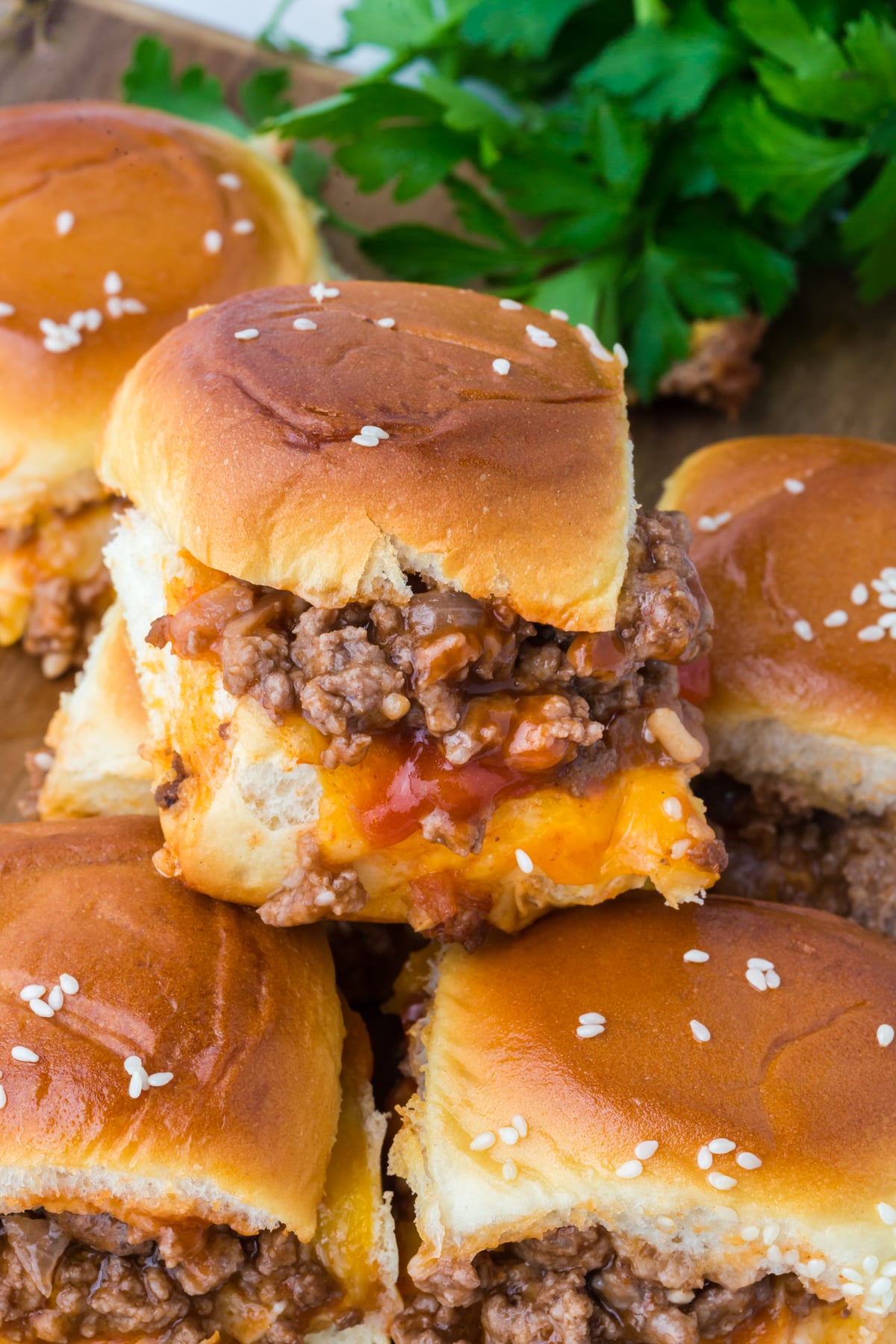 A pile of sliders on a plate.