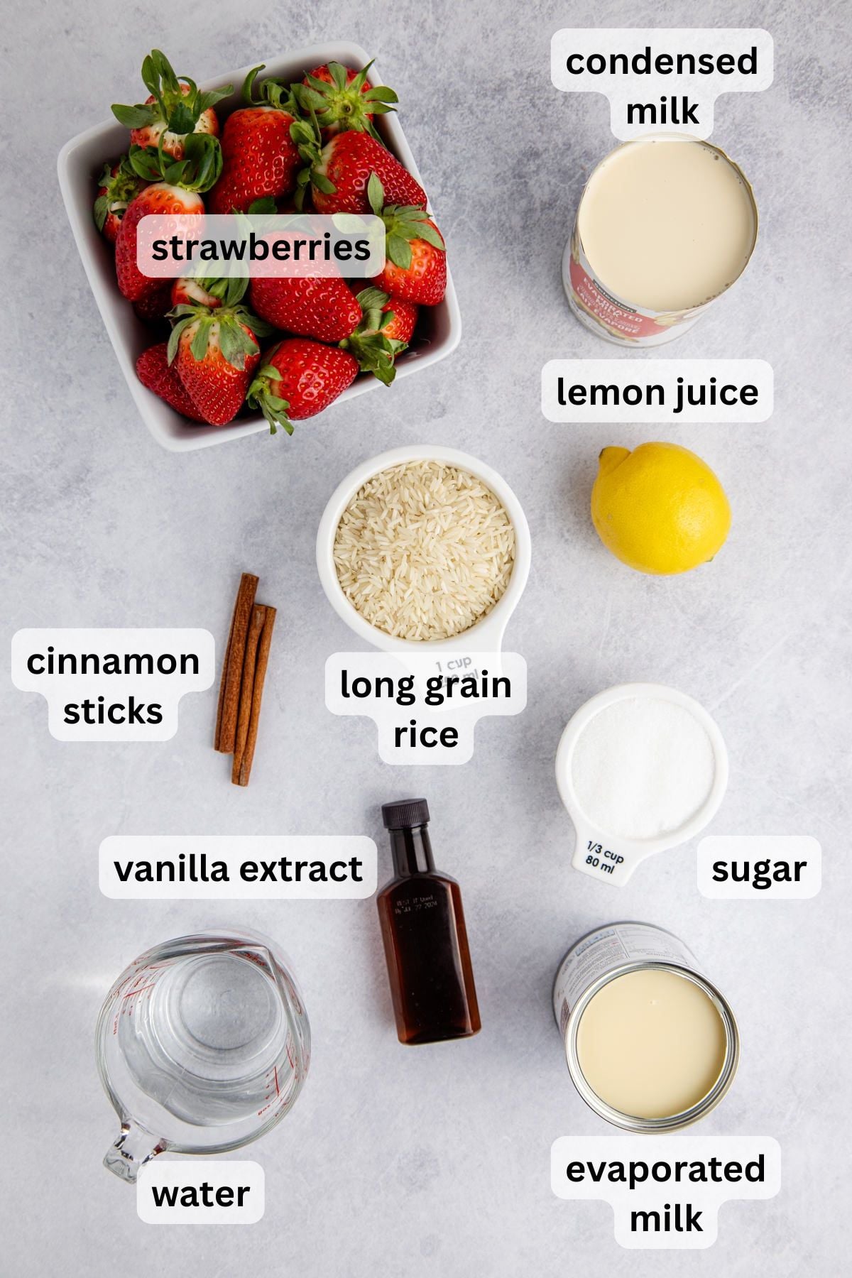 Ingredients to make Strawberry Horchata on a table.