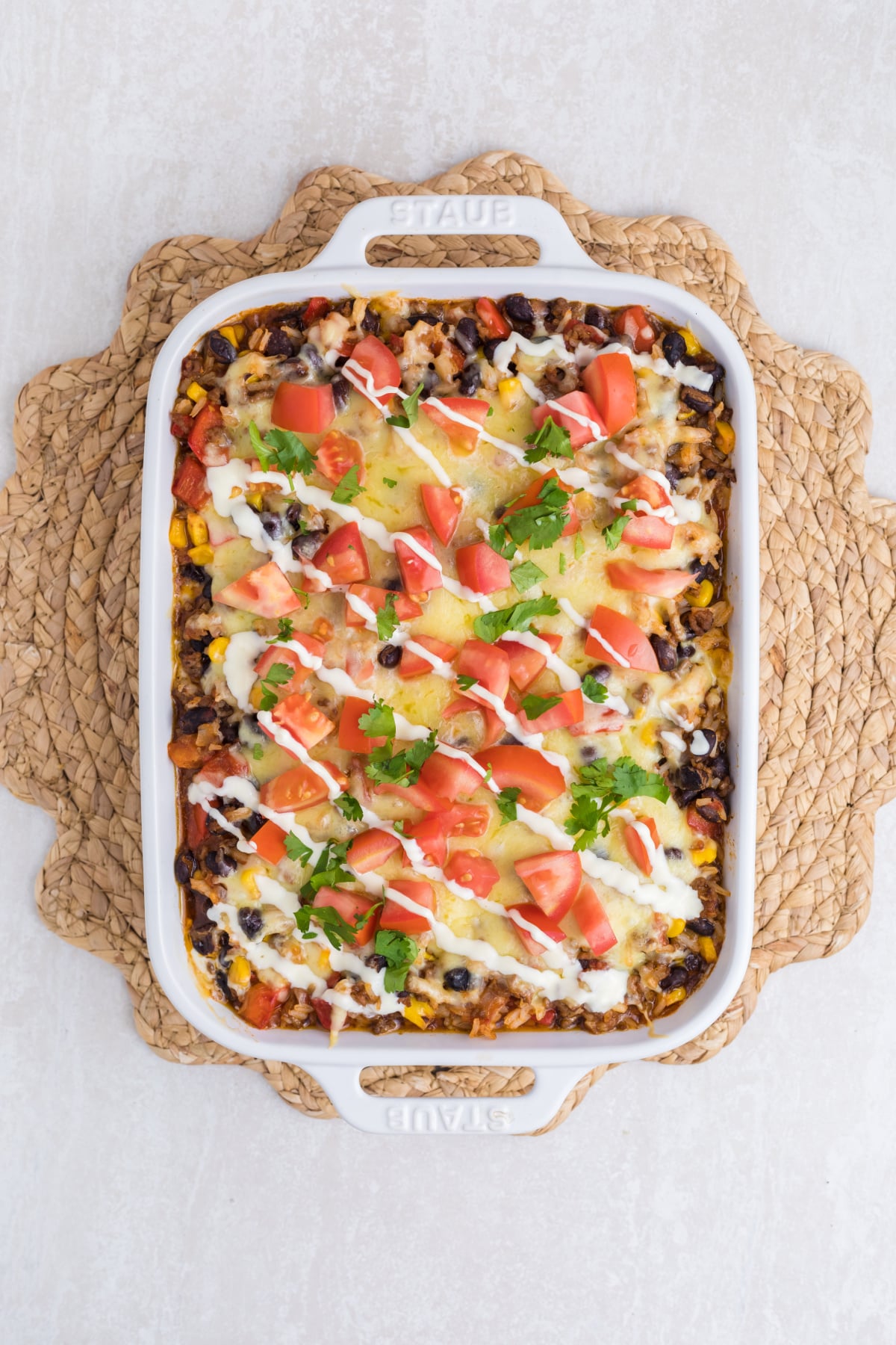Chopped tomatoes, cilantro, and chipotle lime dip garnished on top.