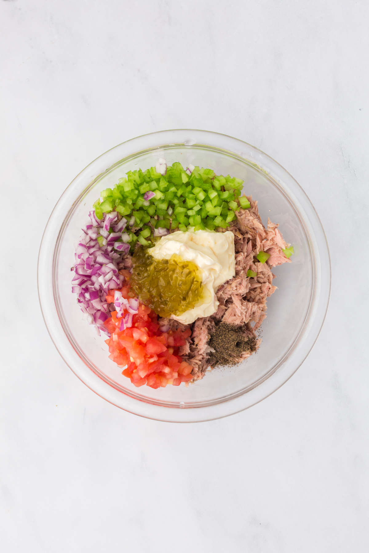 All of the ingredients needed to make tuna in a bowl.