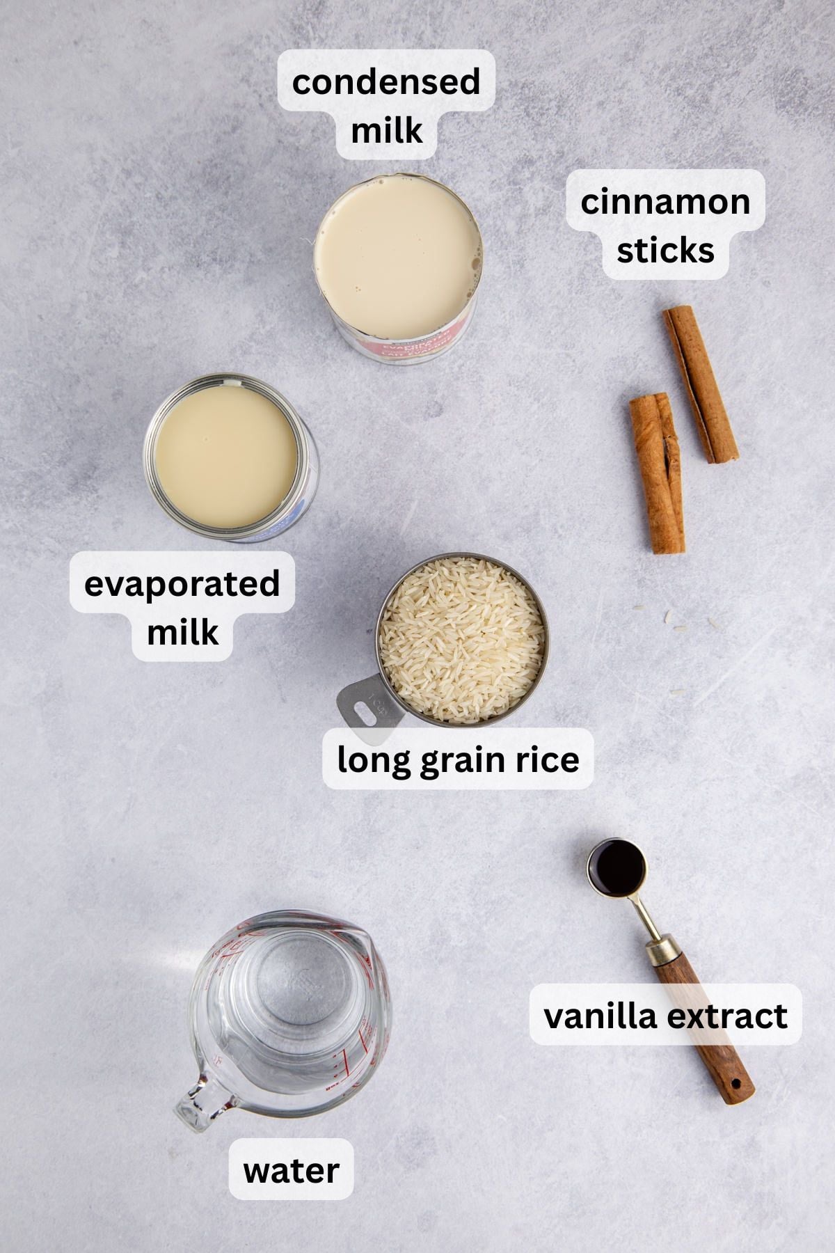 Ingredients for making horchata in measuring items on a table.
