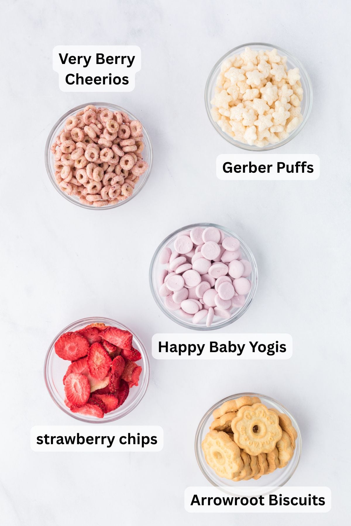Ingredients for Baby Trail Mix in bowls on a table