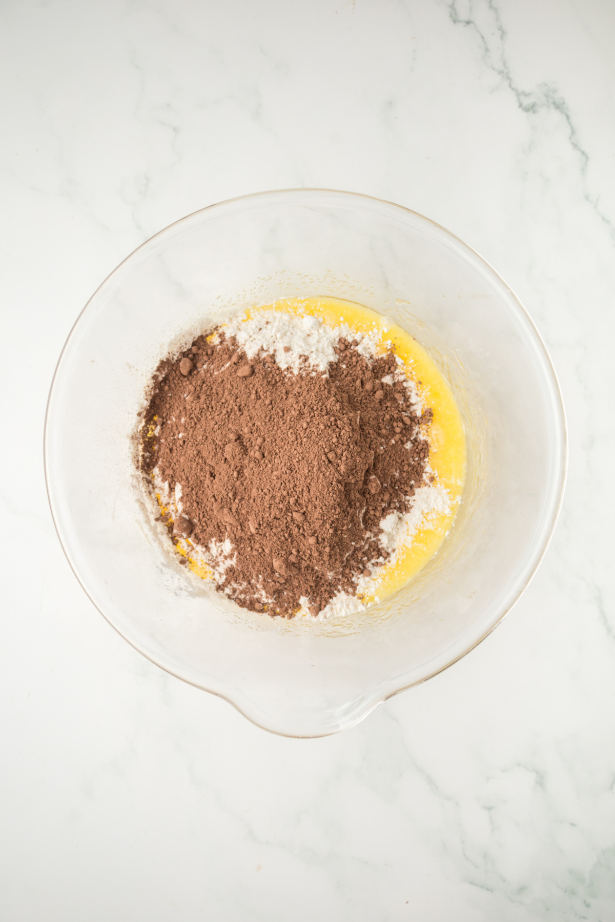 Brownie batter being created in a bowl.