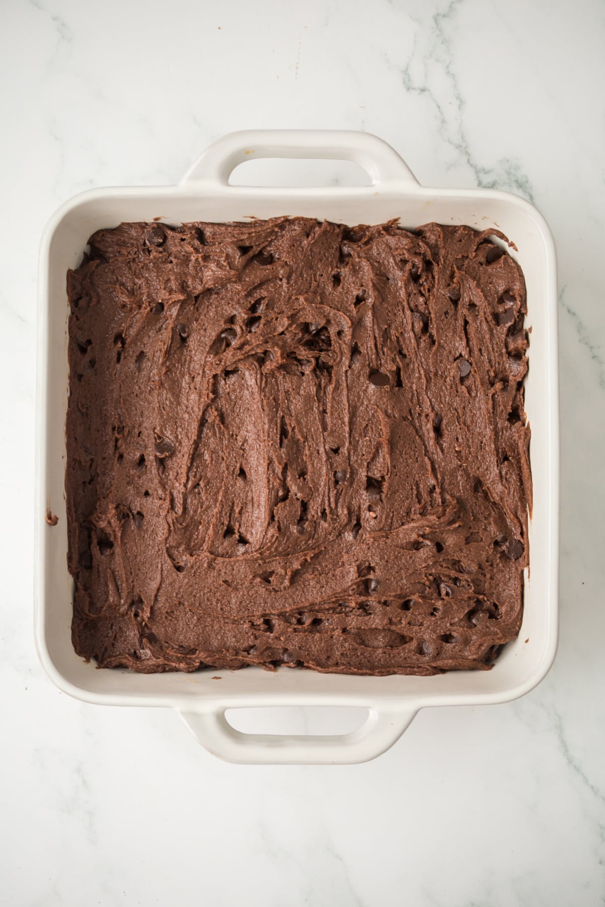 Brownie batter added to pan.