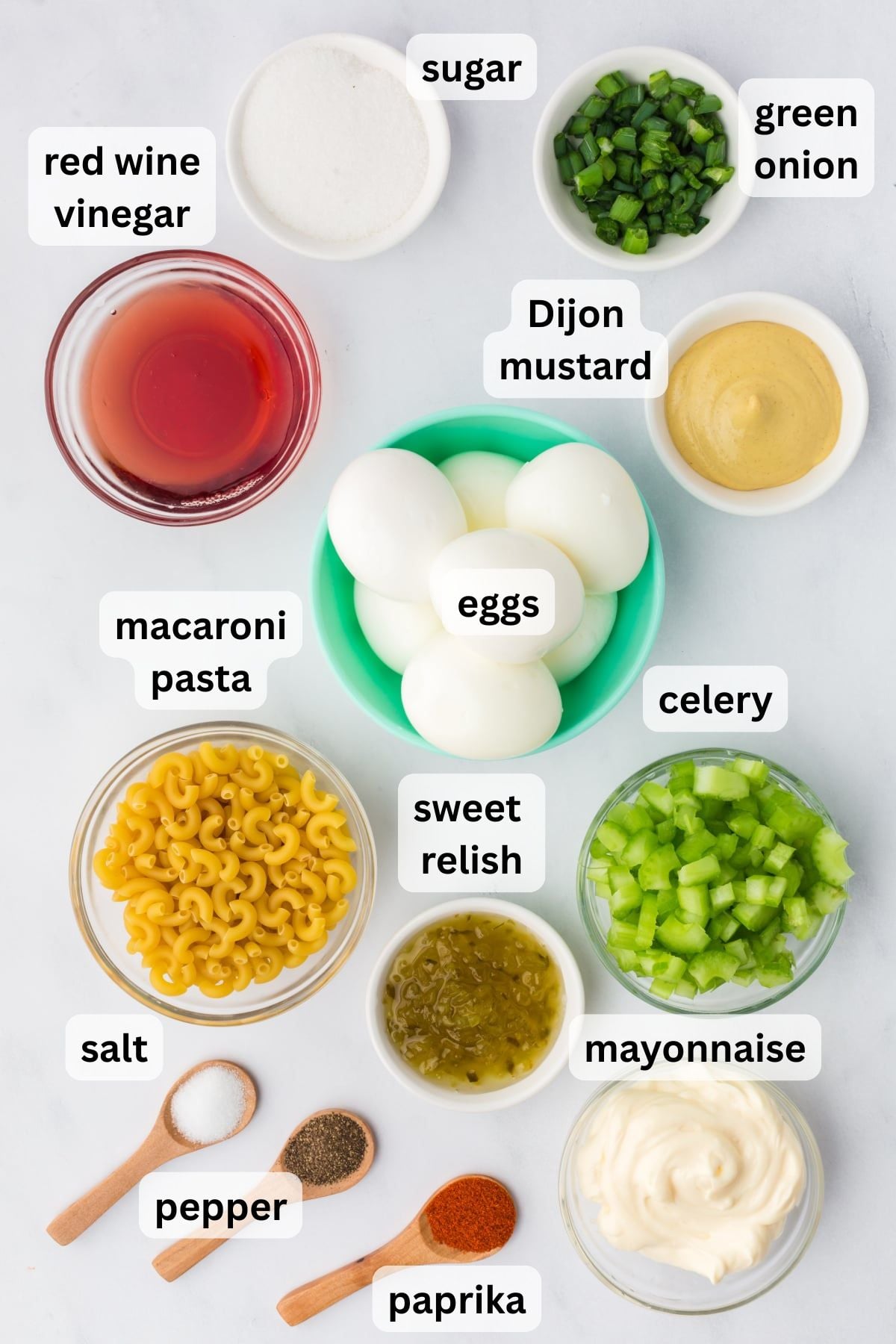Ingredients to make Deviled Egg Macaroni Salad in measuring items on a table