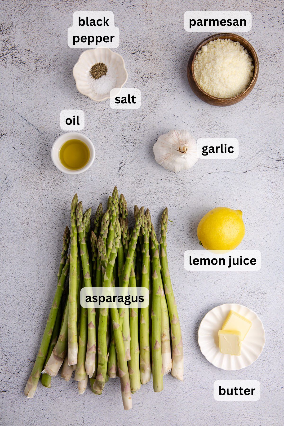 Ingredients for garlic parmesan asparagus on a table