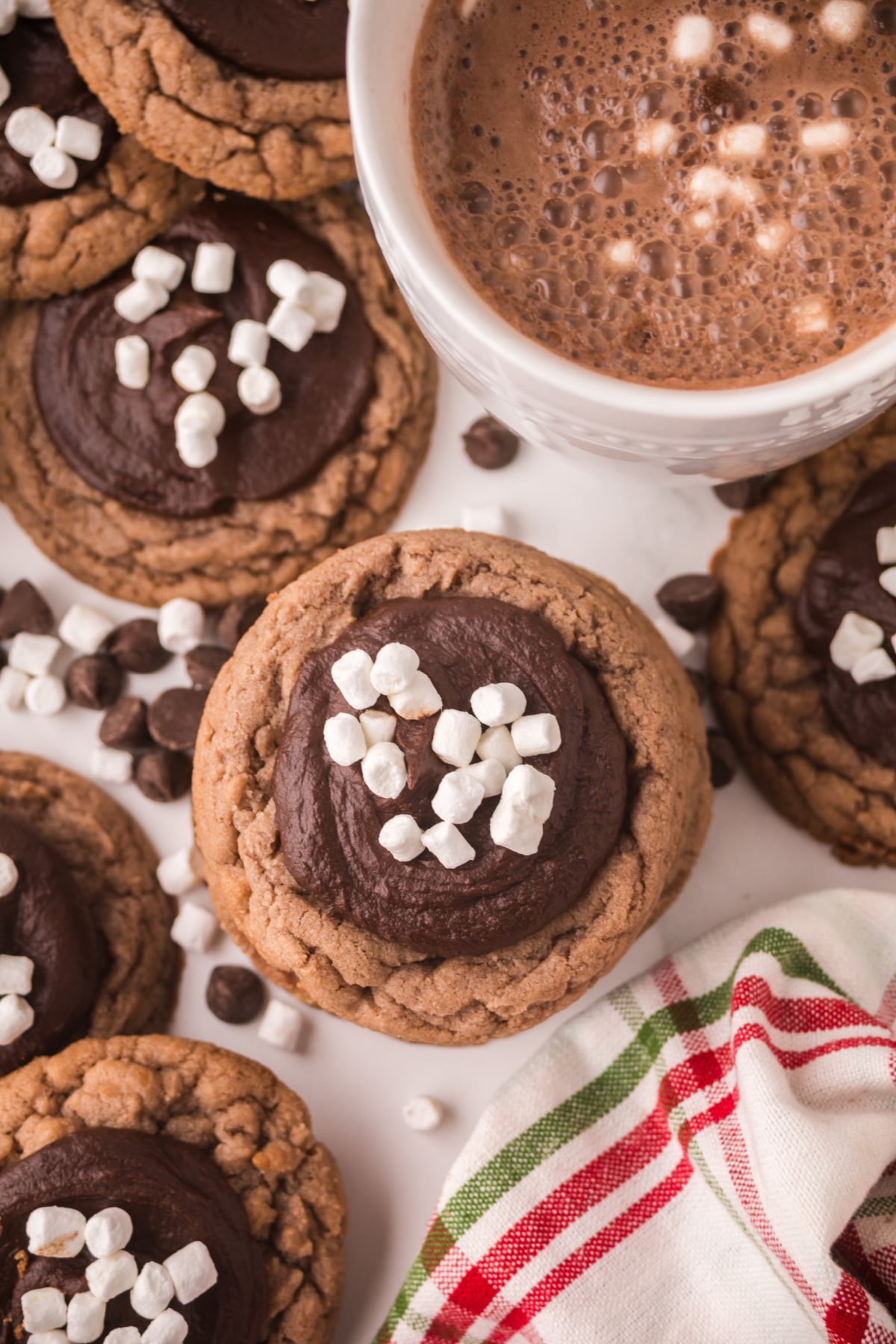 A hot cocoa cookie with marshmallows on top.