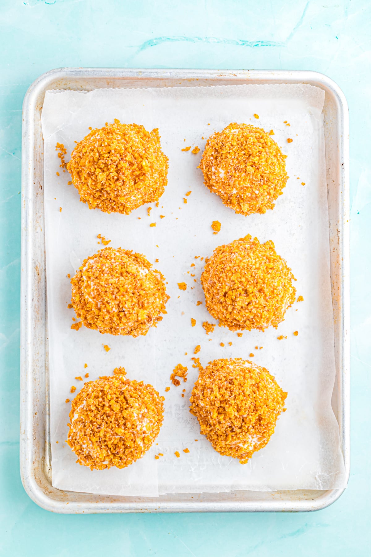 The cornflakes mixture rolled onto each ice cream ball.
