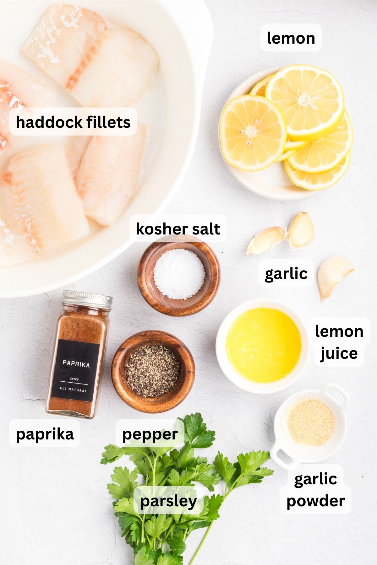 Ingredients to make baked haddock on a table.