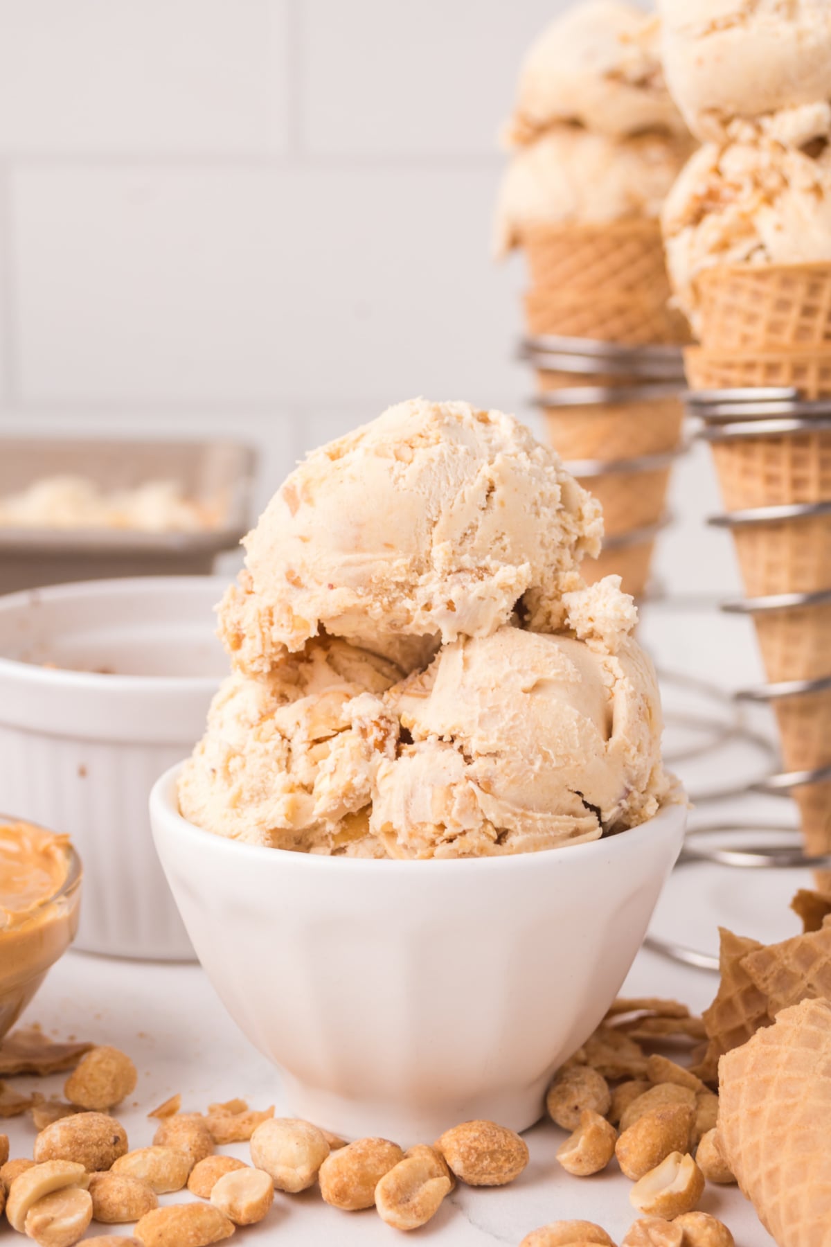 A bowl full of three scoops of ice cream.